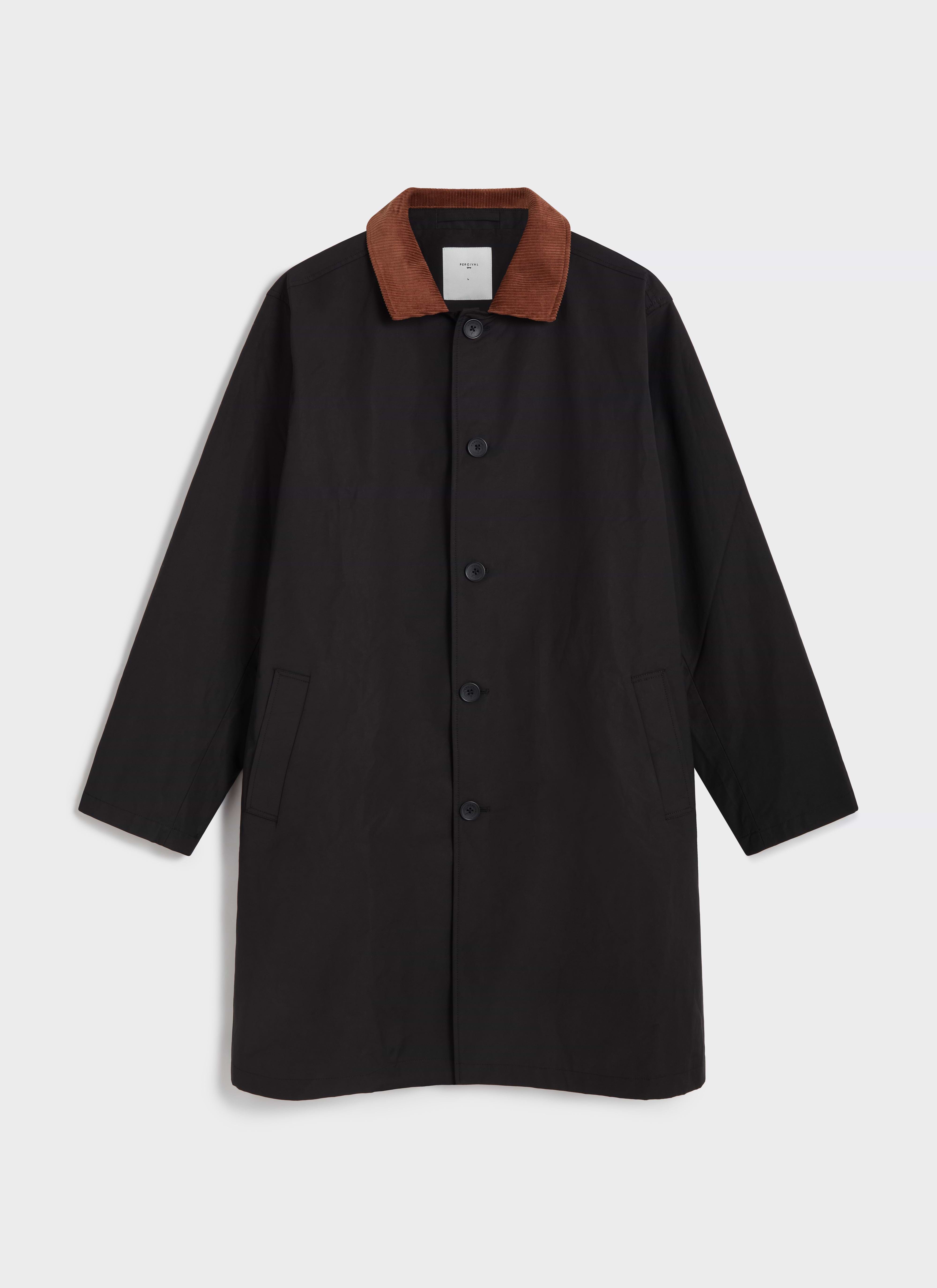 The Percival Mac Cord Collar Coat in black cotton, featuring a tan corduroy collar and single-breasted button front.