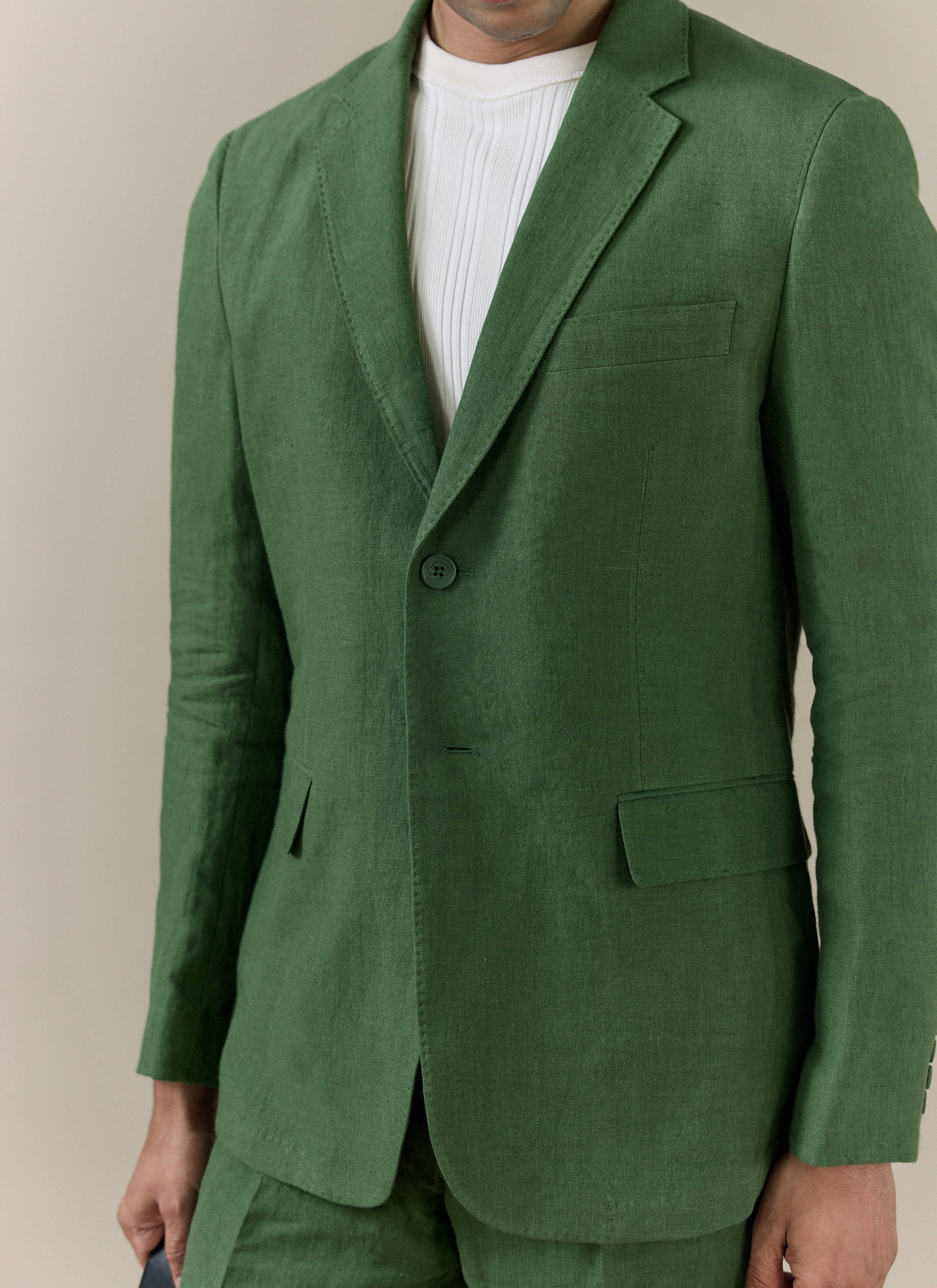 Forest green Percival Slim Fit Classic Blazer in breathable linen, featuring a notch lapel and flap pockets.