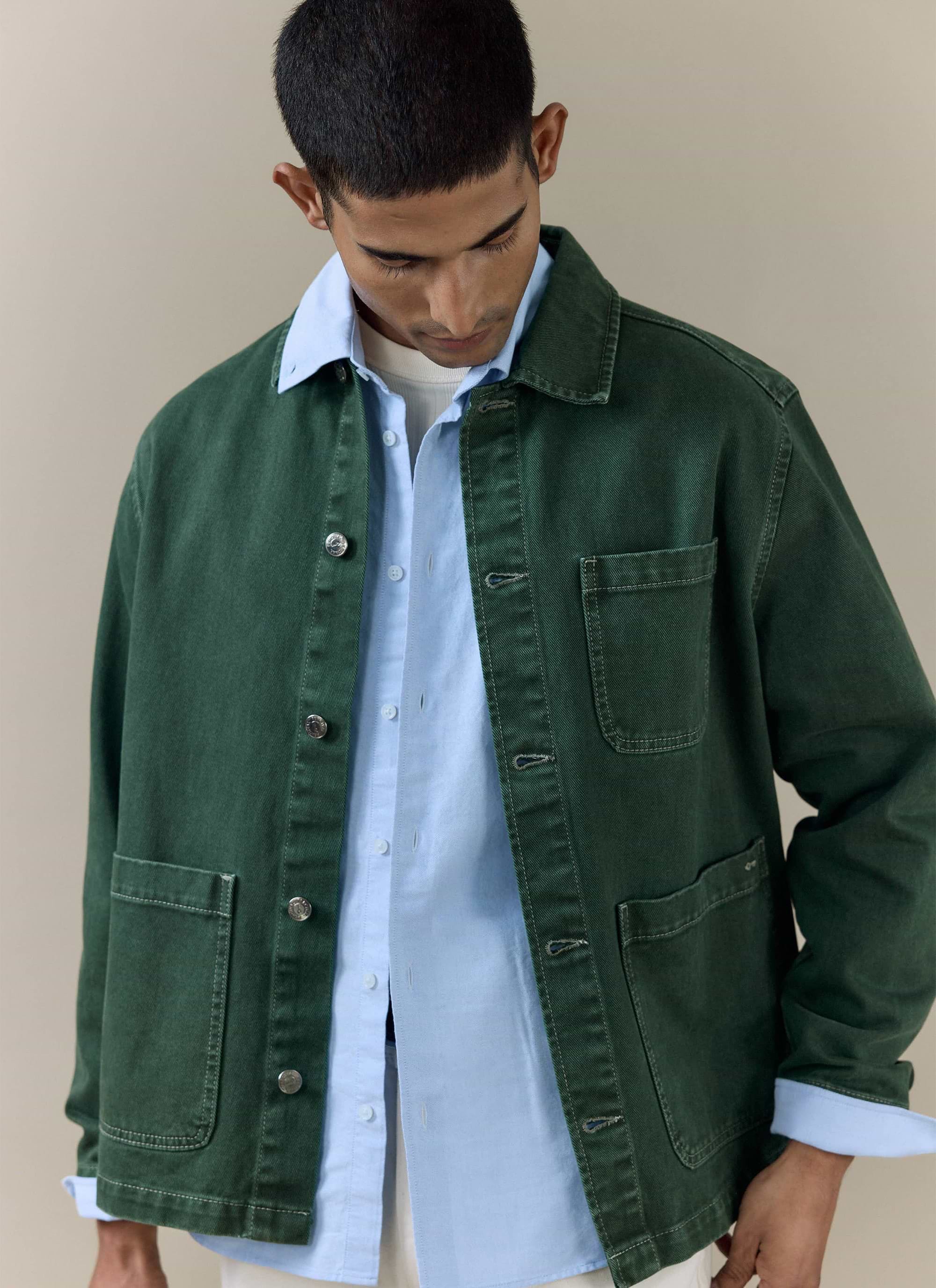 Percival forest green Vintage Wash Oliver Chore Jacket in cotton canvas, styled over a light blue shirt.