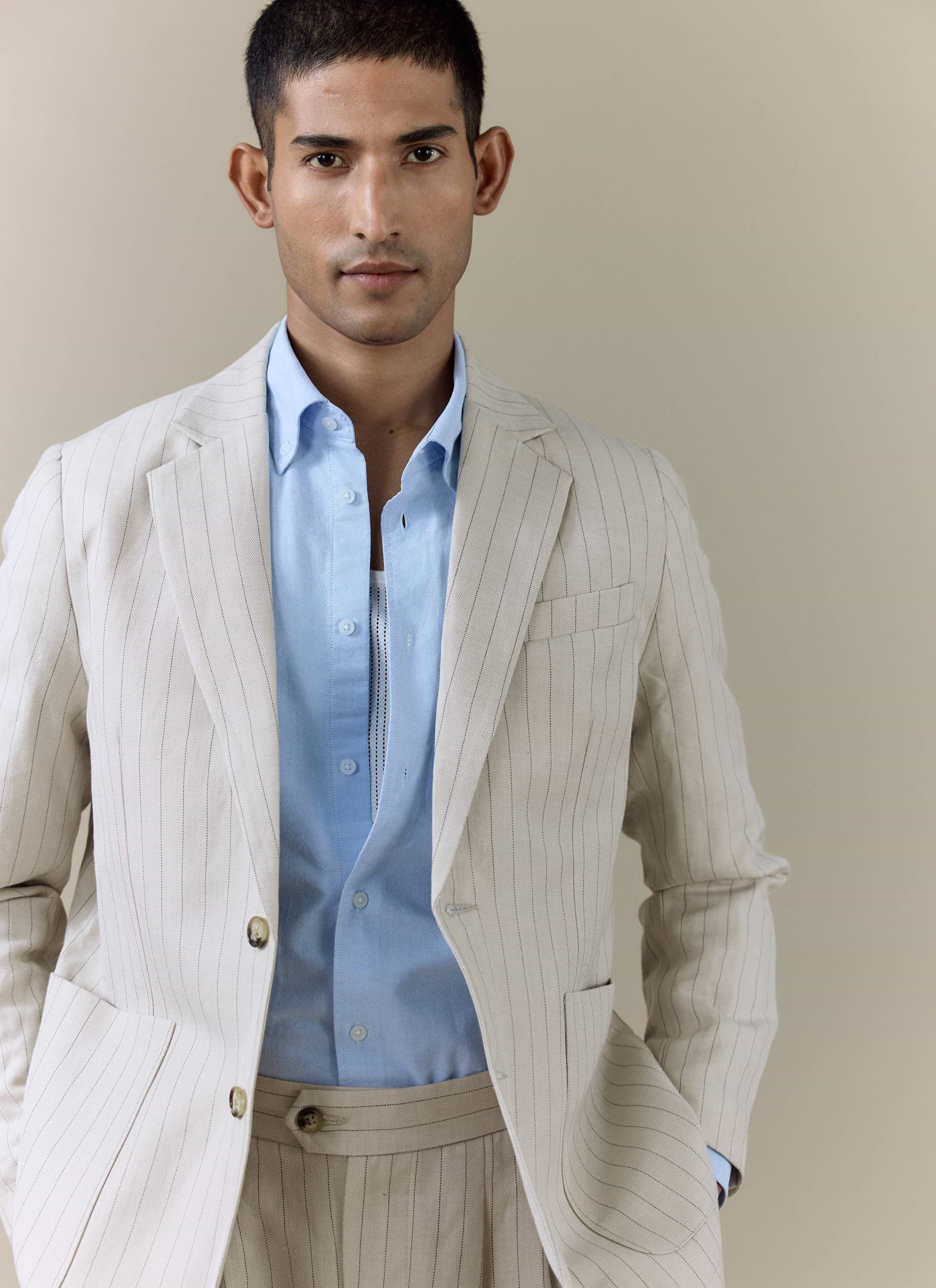 Percival Striped Tailored Blazer in cream linen blend, featuring subtle pinstripes and styled with a blue shirt.