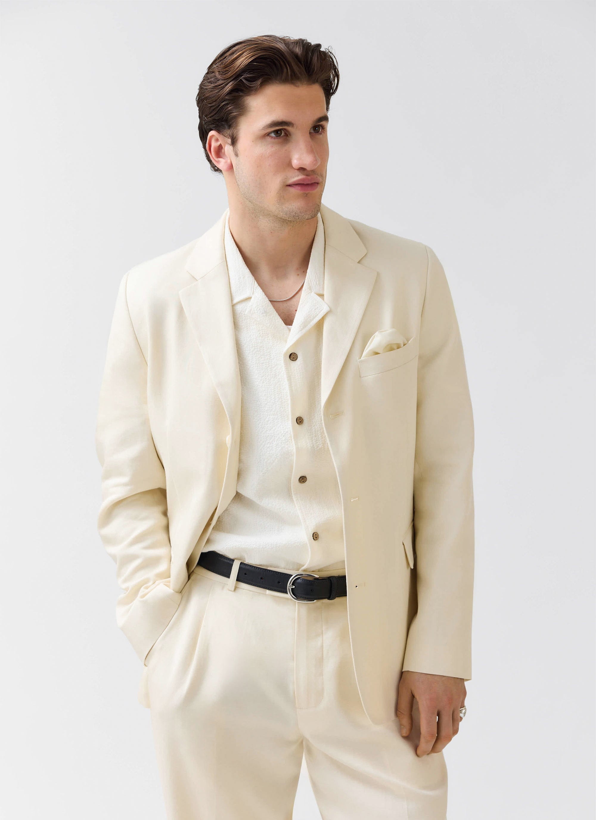 A model wears the Percival Clifton 3 Button Blazer in cream lyocell, styled as a three-piece suit against a white background.