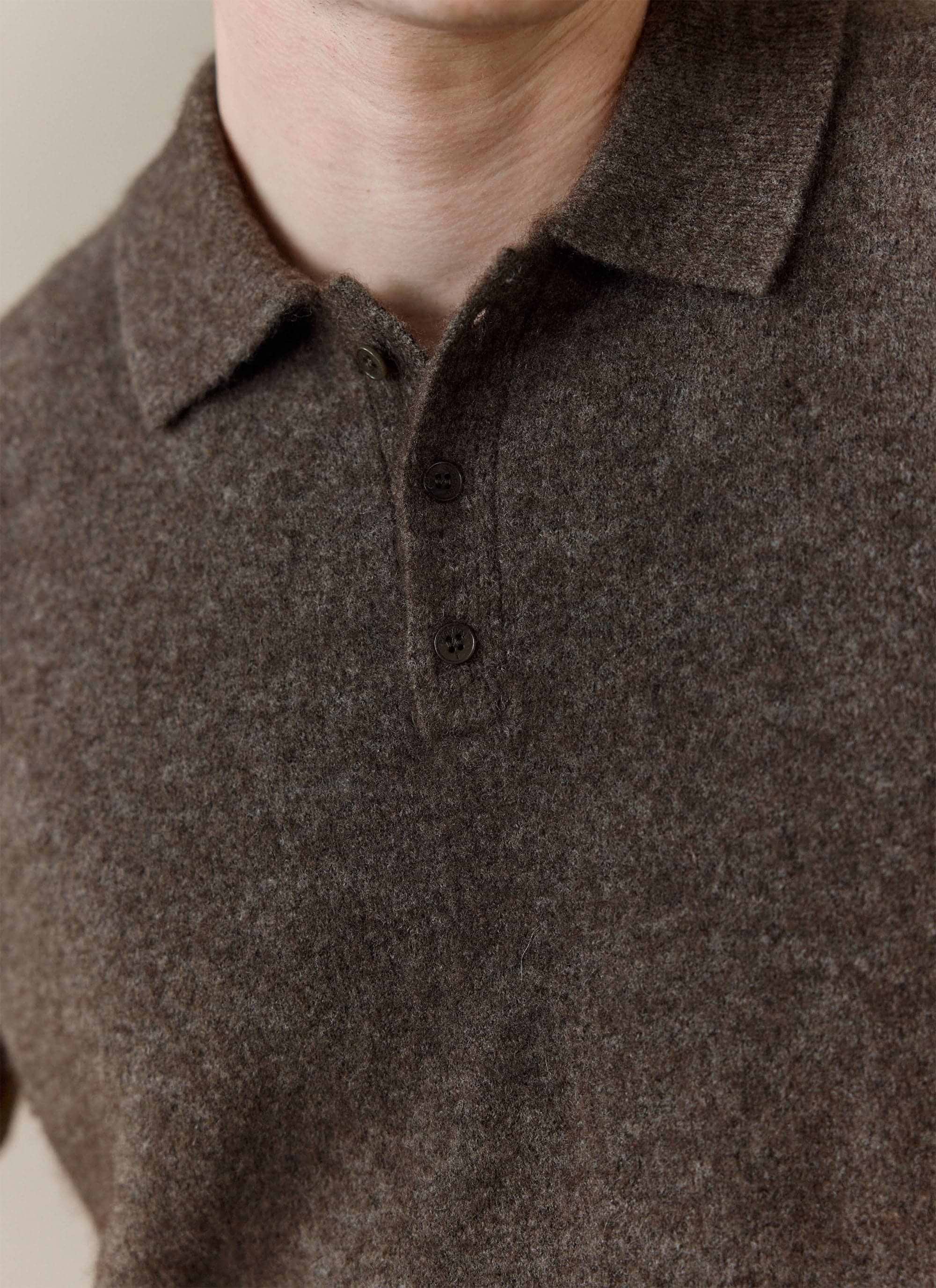 A close-up of the Percival Collins Boxy Knitted Polo in Espresso, showing the soft yak-wool blend fabric and button placket.