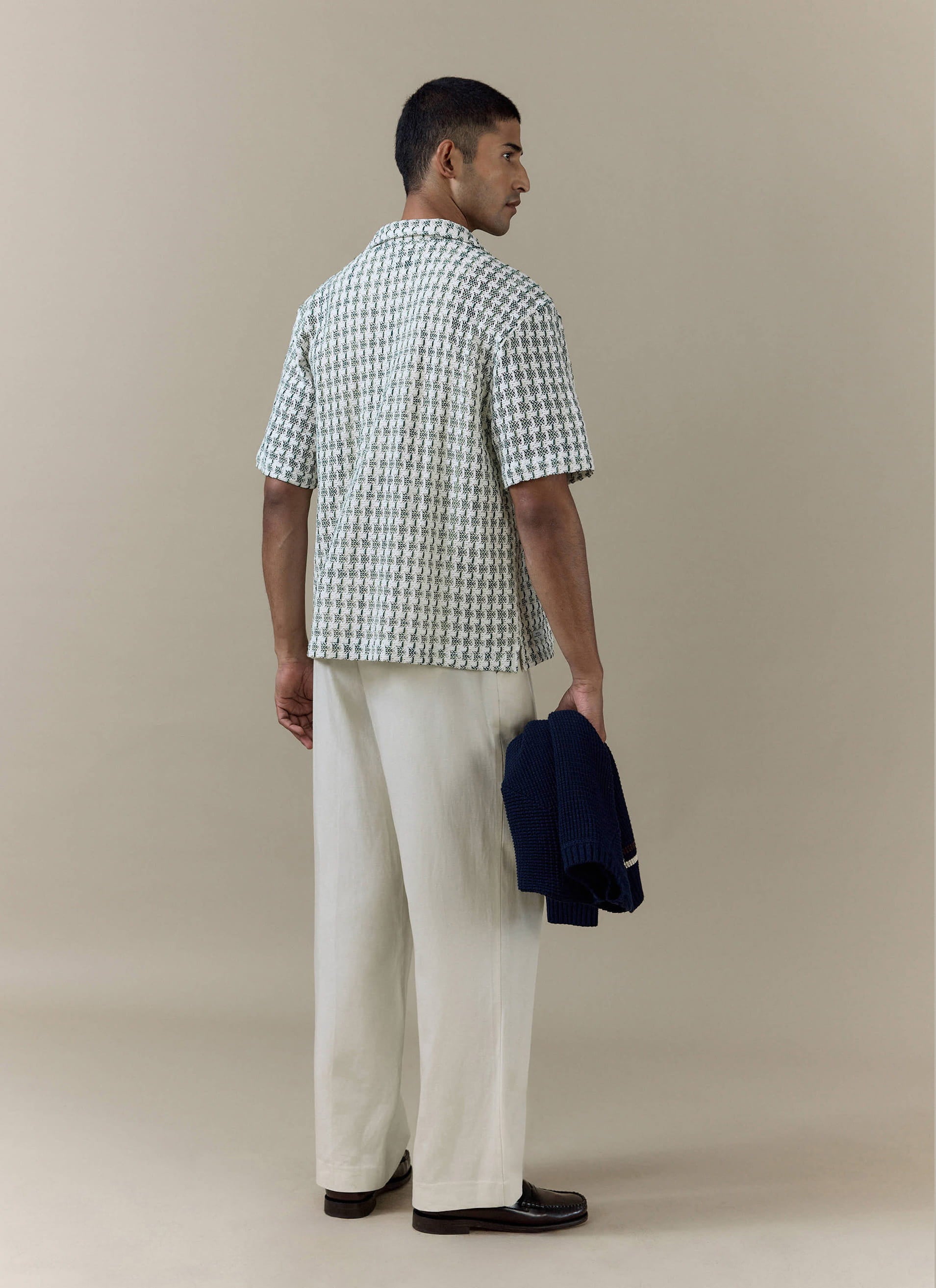 Rear view of the green textured Freddie Crochet Boxy Shirt from Percival, featuring an open-weave cotton construction.