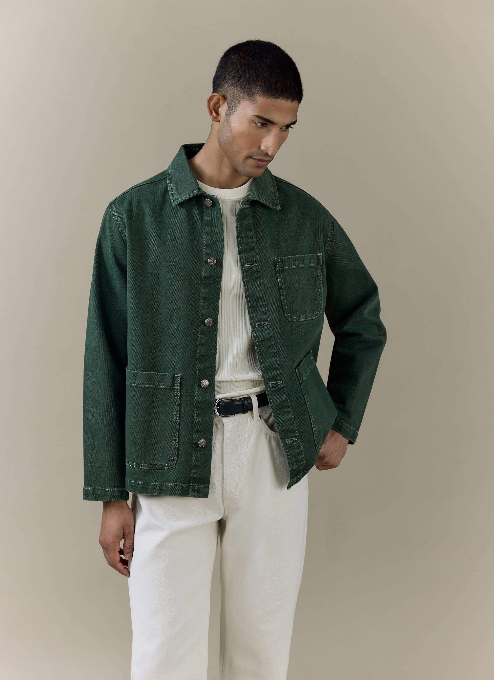 Model wearing the Percival Oliver Chore Jacket in forest green cotton canvas with a vintage wash.