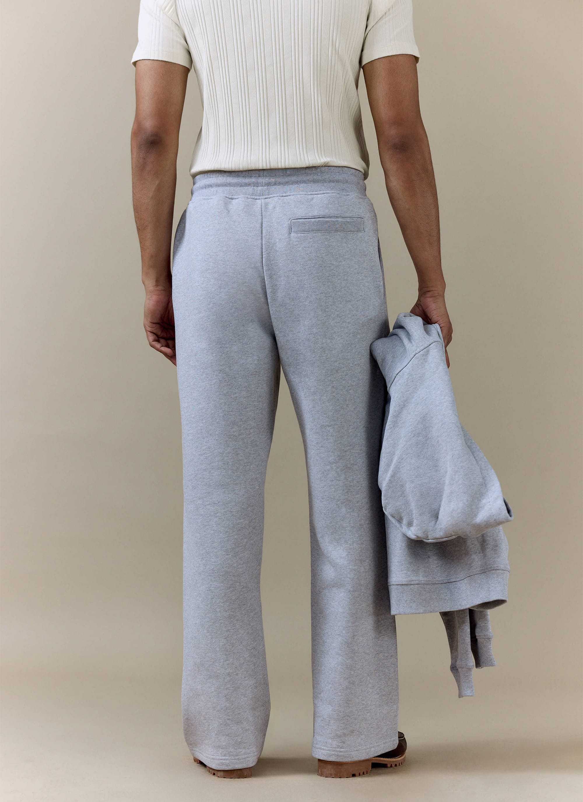 Back view of the Percival Chronicle Straight Leg Trackpants in grey cotton jersey, showing the fit and rear pocket.