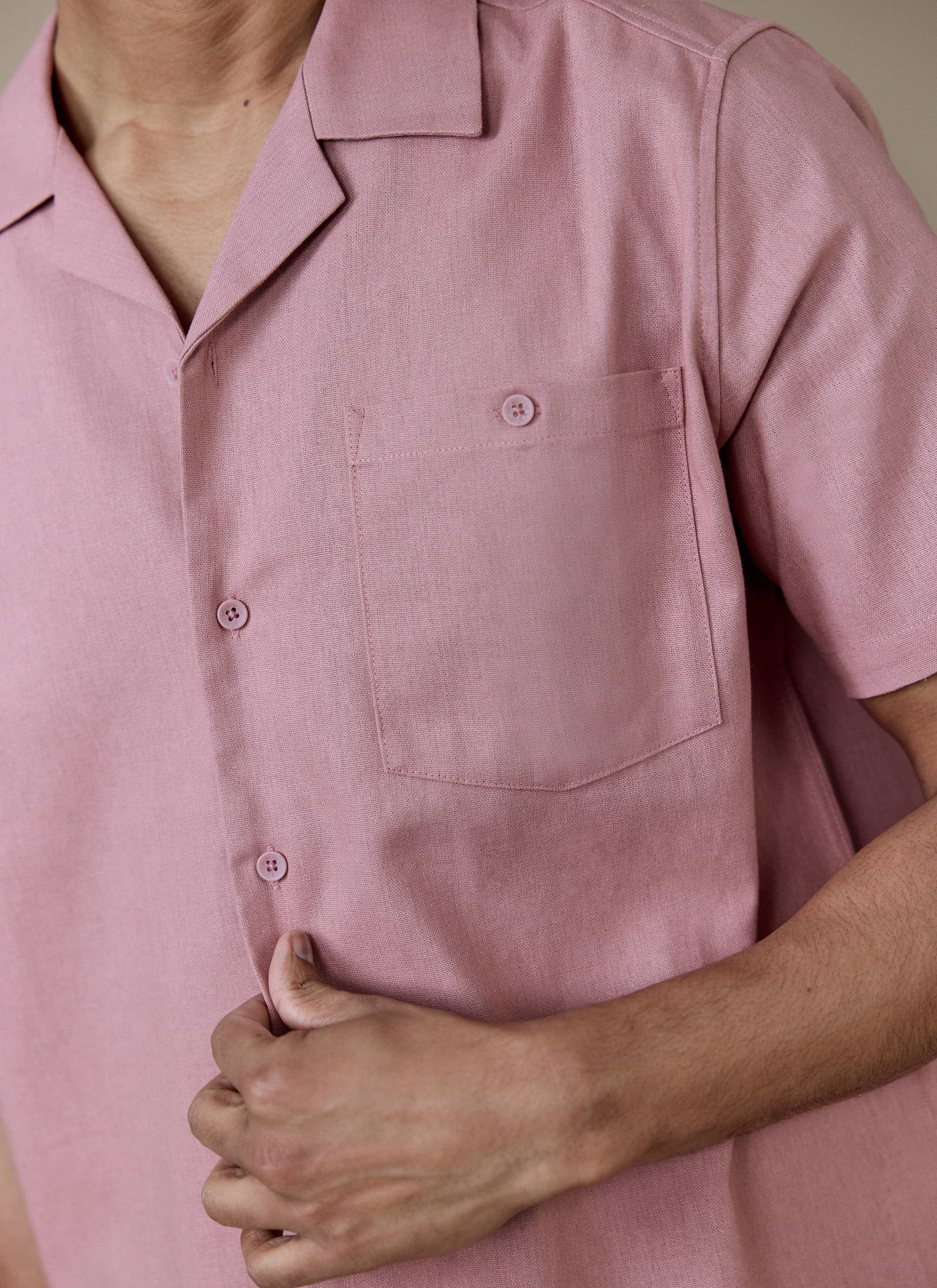 Close-up of the Percival Short Sleeve Cuban Shirt in dusty pink linen, featuring tonal buttons and a buttoned chest pocket.
