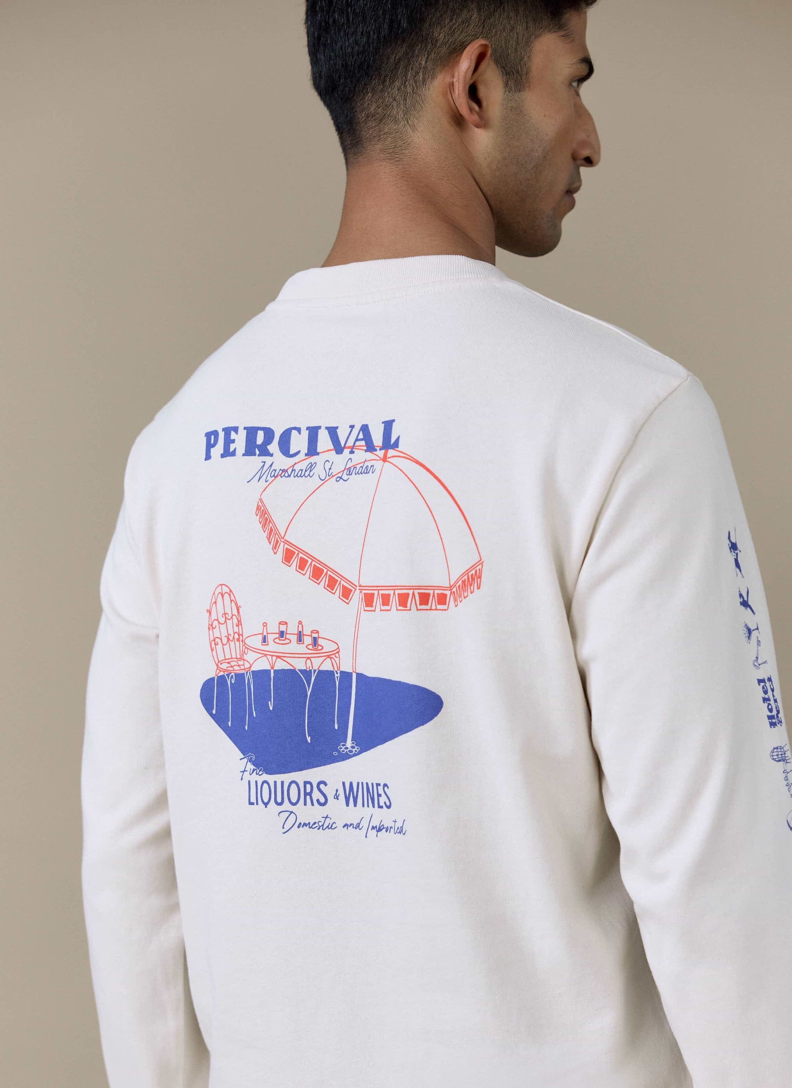 Back of the cream Percival Harlow Fine Wines long sleeve T-shirt, featuring a large blue and red bistro-style back graphic.
