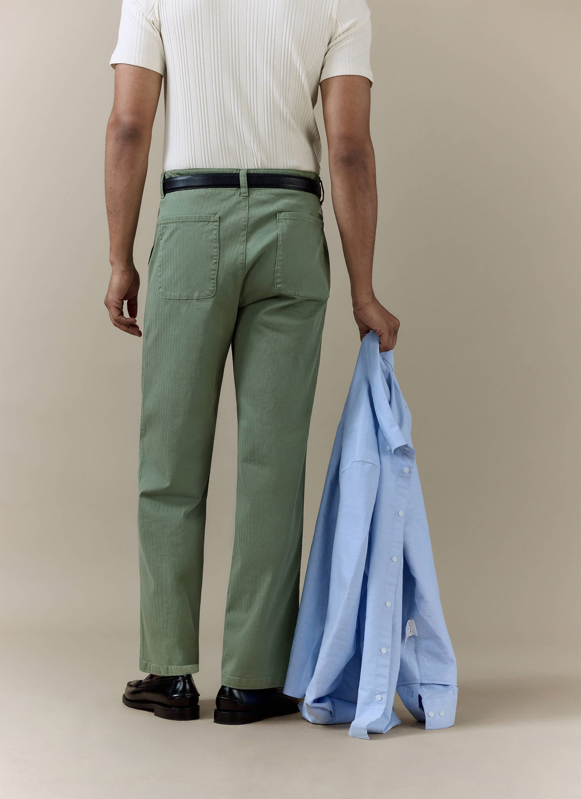 Rear view of the sage green Lungo Herringbone Straight Trousers by Percival, featuring a textured cotton finish.