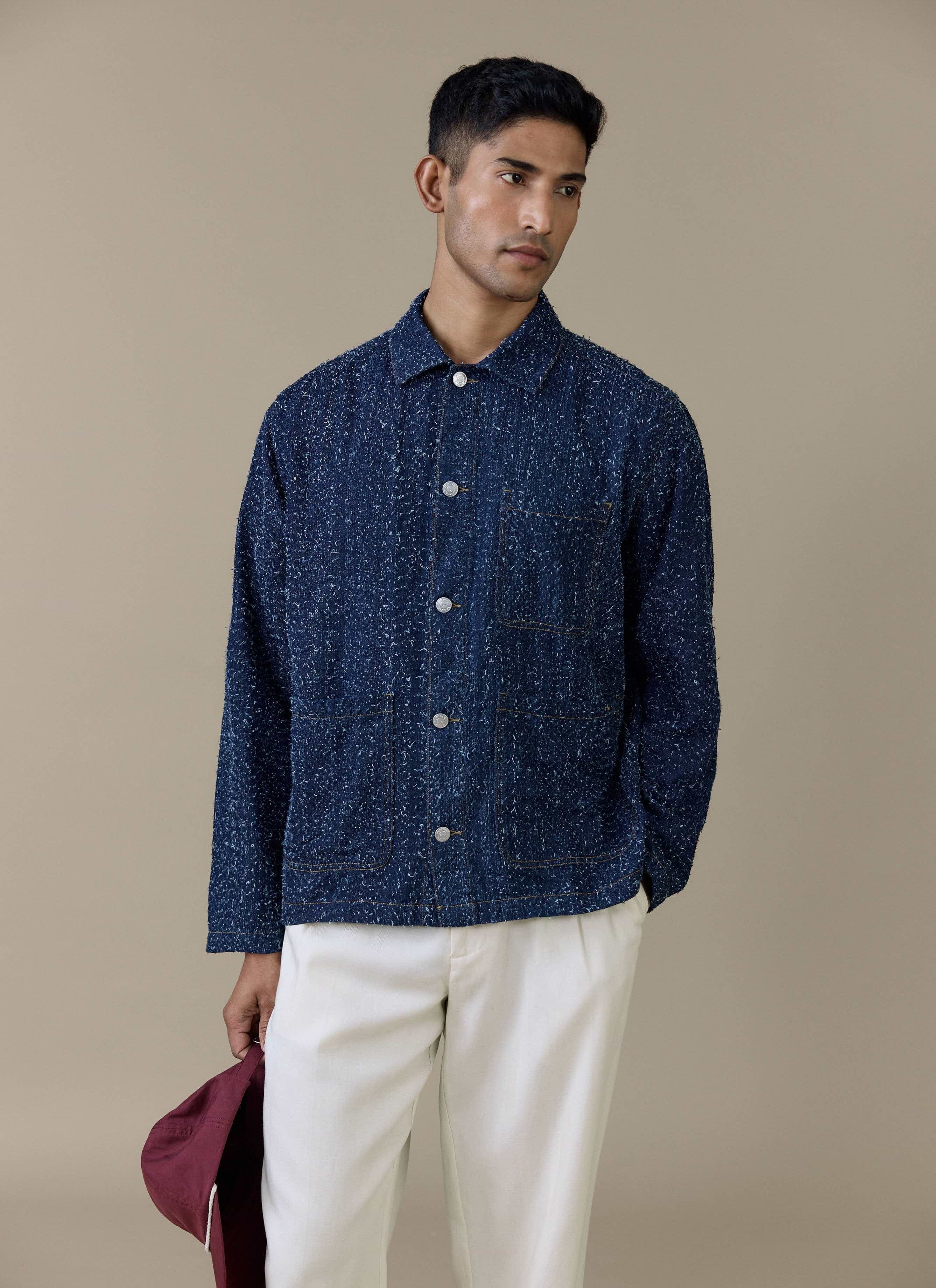 Model wearing the navy textured cotton Parsons Chore Jacket by Percival with patch pockets and press-stud buttons.
