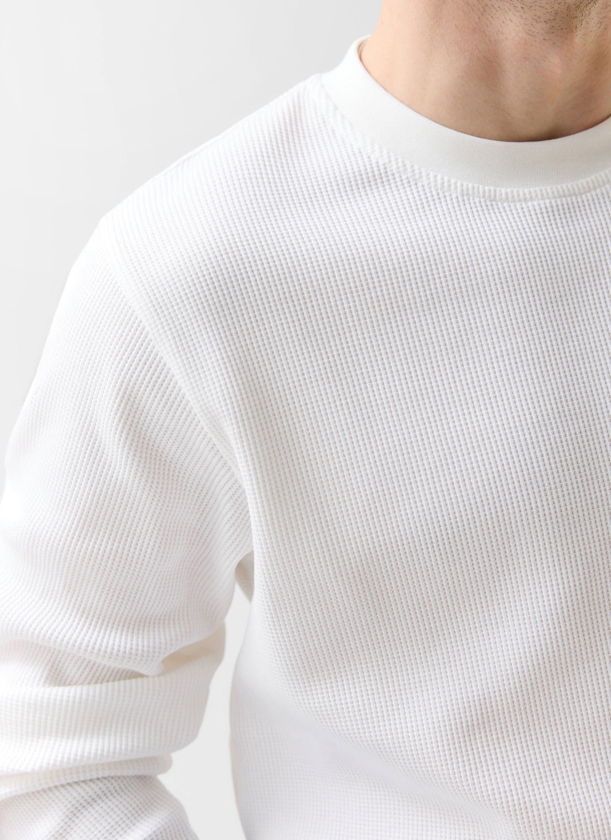 Close up of the Percival Waffle Long Sleeve T-Shirt in white, showing the organic cotton waffle knit texture.