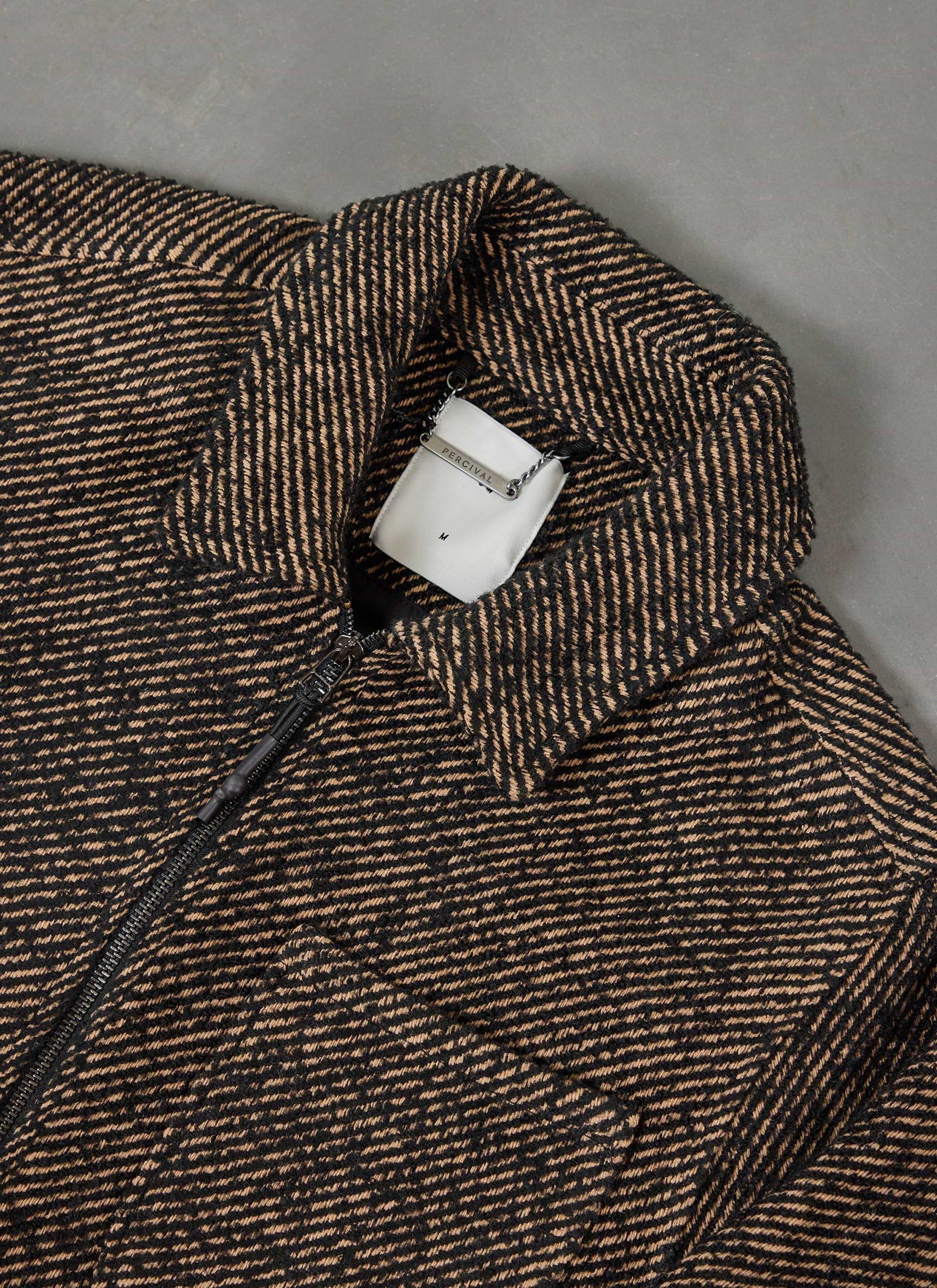 close up of the percival zip overshirt in oak and black twill, showing the diagonal pattern and branded collar.