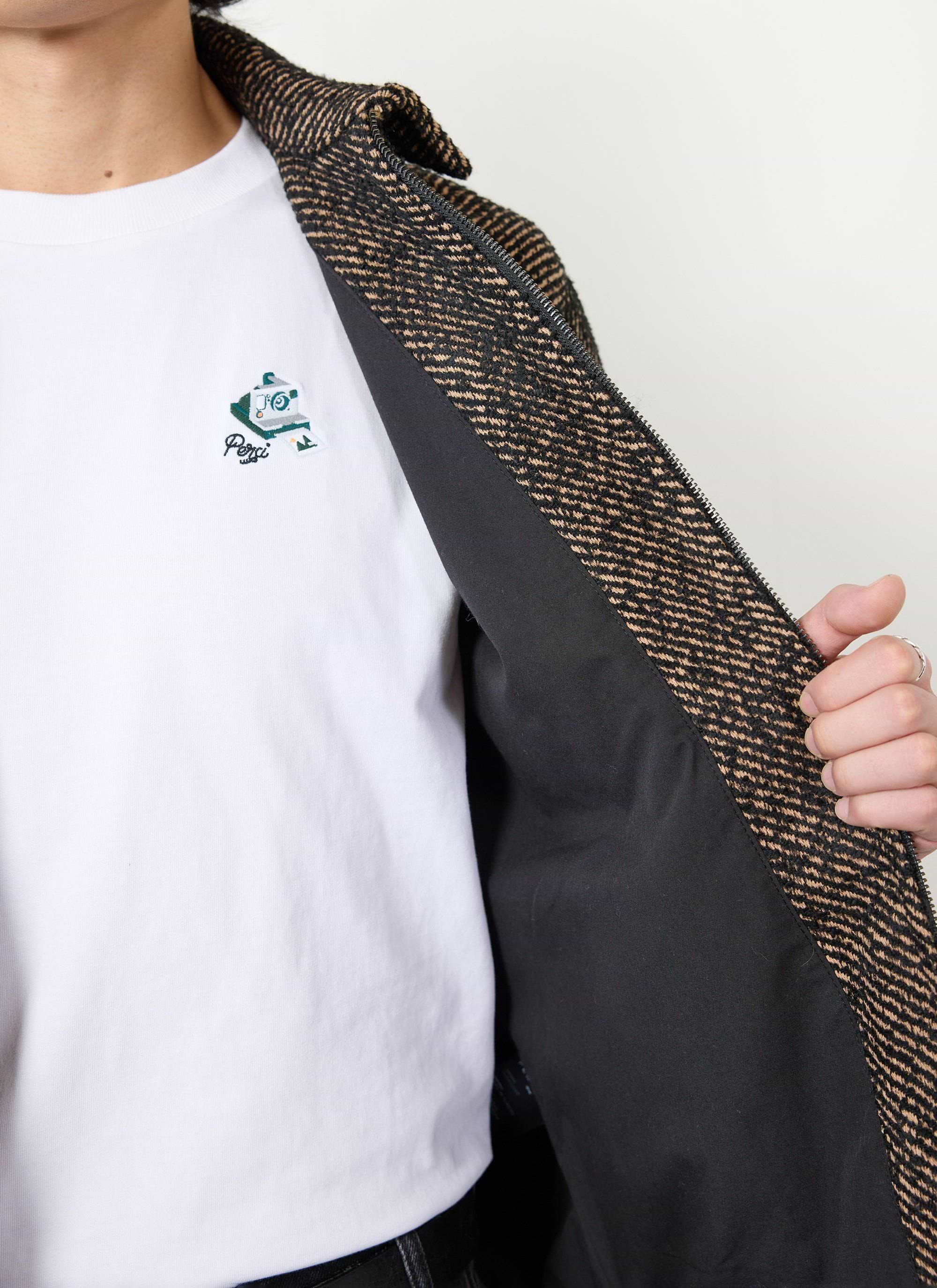 A close up of the Percival Zip Overshirt in Oak Twill, showing the textured fabric and black internal lining.