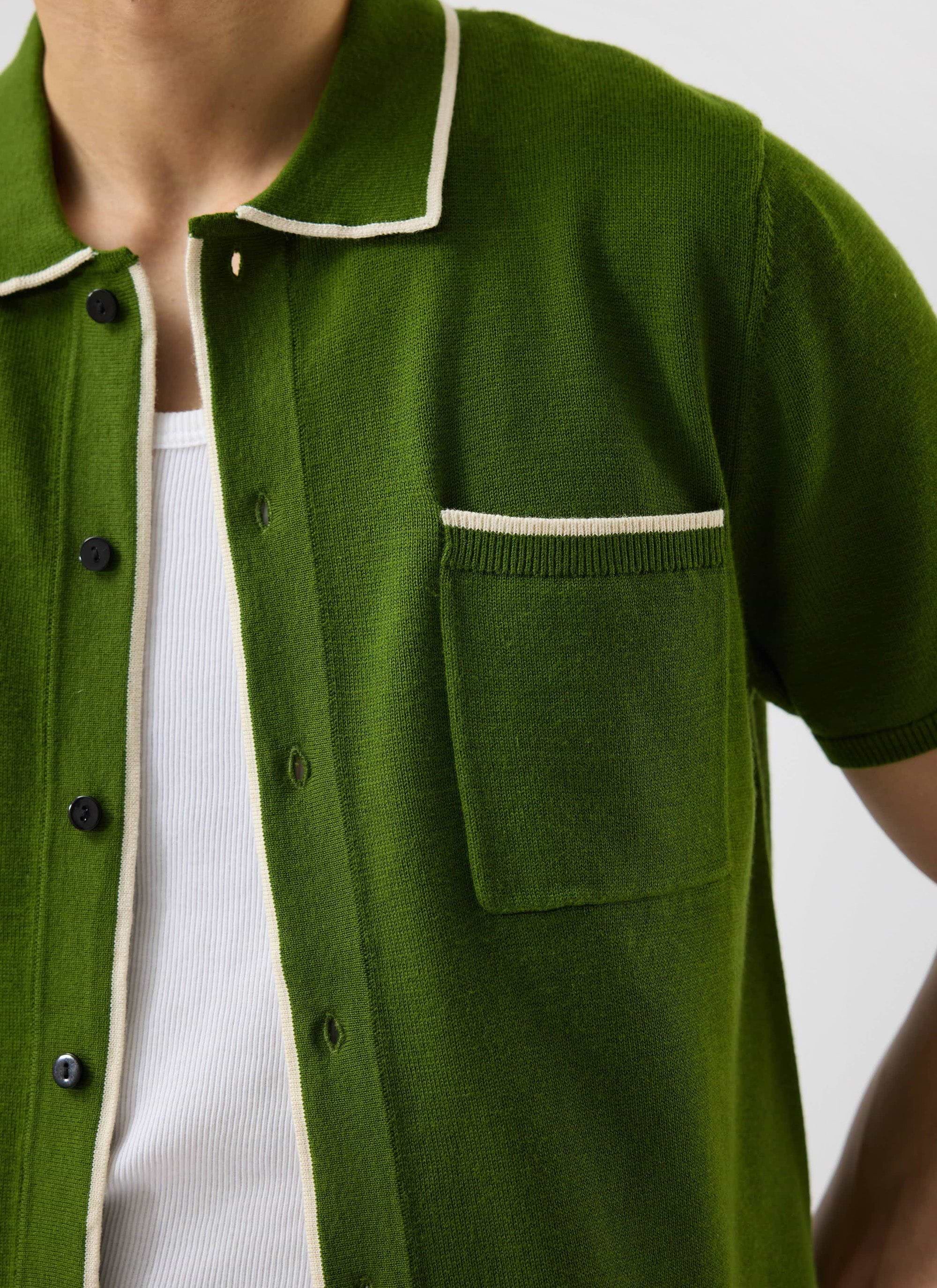 Close-up of the Percival Contrast Trim Shirt in forest green, showing the ecru trim detail on the pocket and collar.