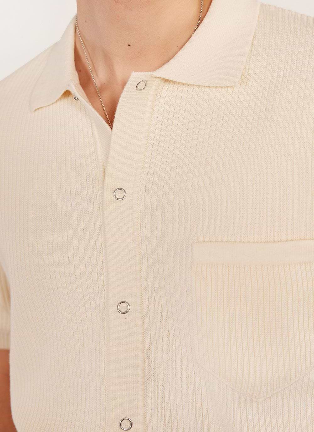 Close up of the Percival Pablo Cuban shirt in cream, showing the knitted texture, popper buttons and chest pocket.