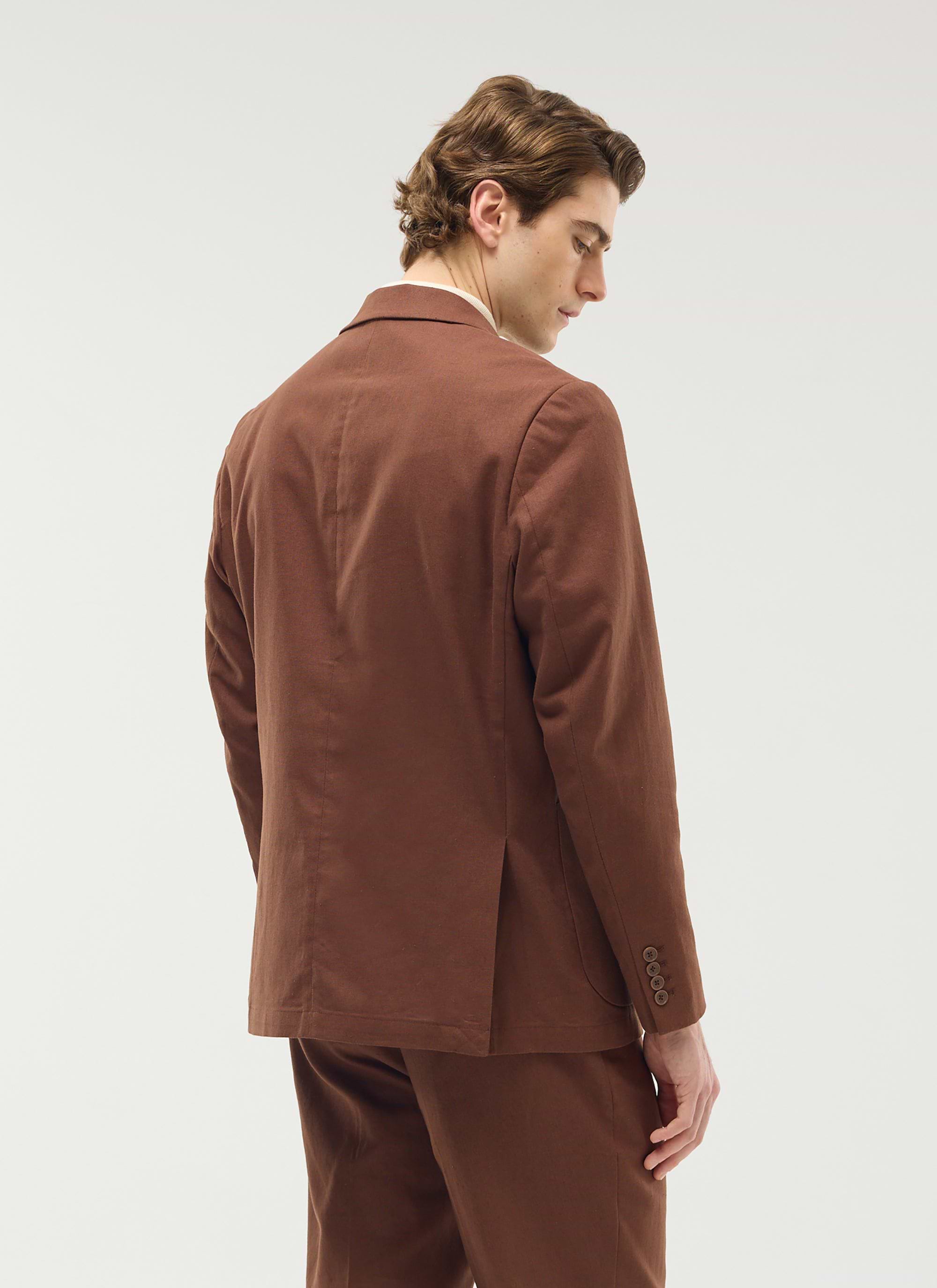 The Percival Tailored Linen Blazer in brown, shown from behind on a model to highlight its tailored fit.
