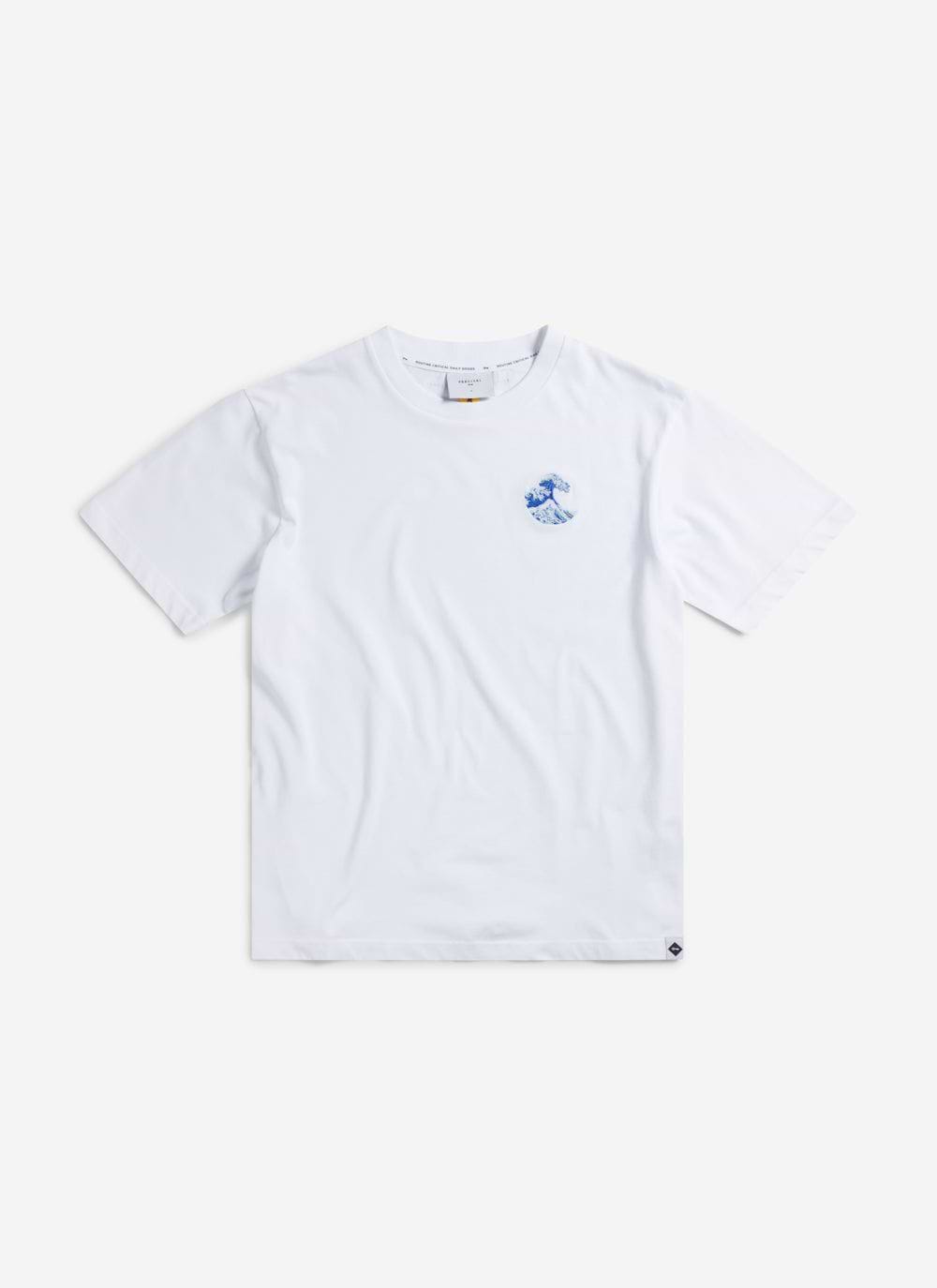 The Percival Wave T-shirt in white organic cotton, featuring a detailed blue embroidered wave on the chest.