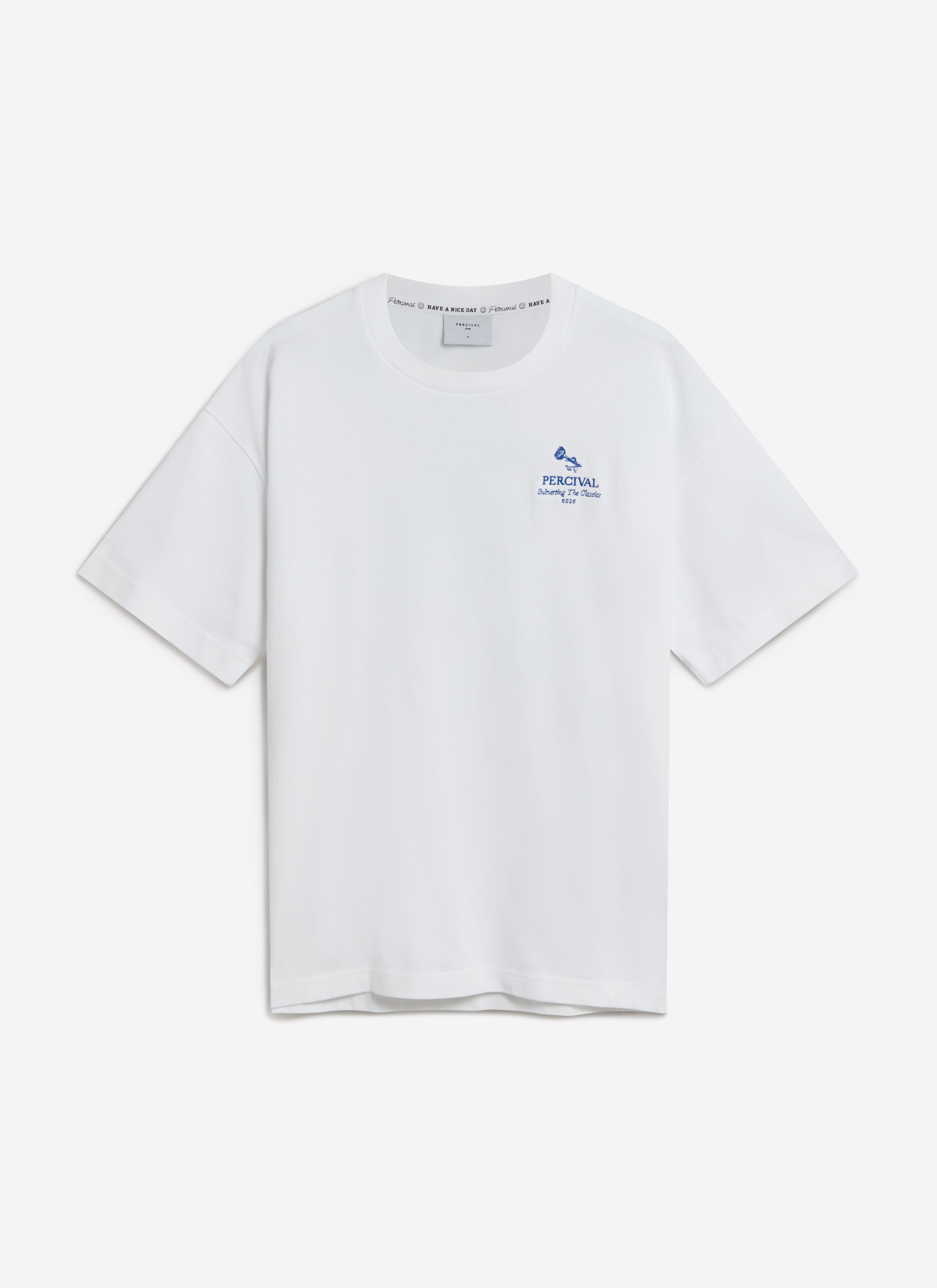 A flat lay of the Percival Smith Floral Oversized T-Shirt in white organic cotton, showing the blue embroidered chest logo.