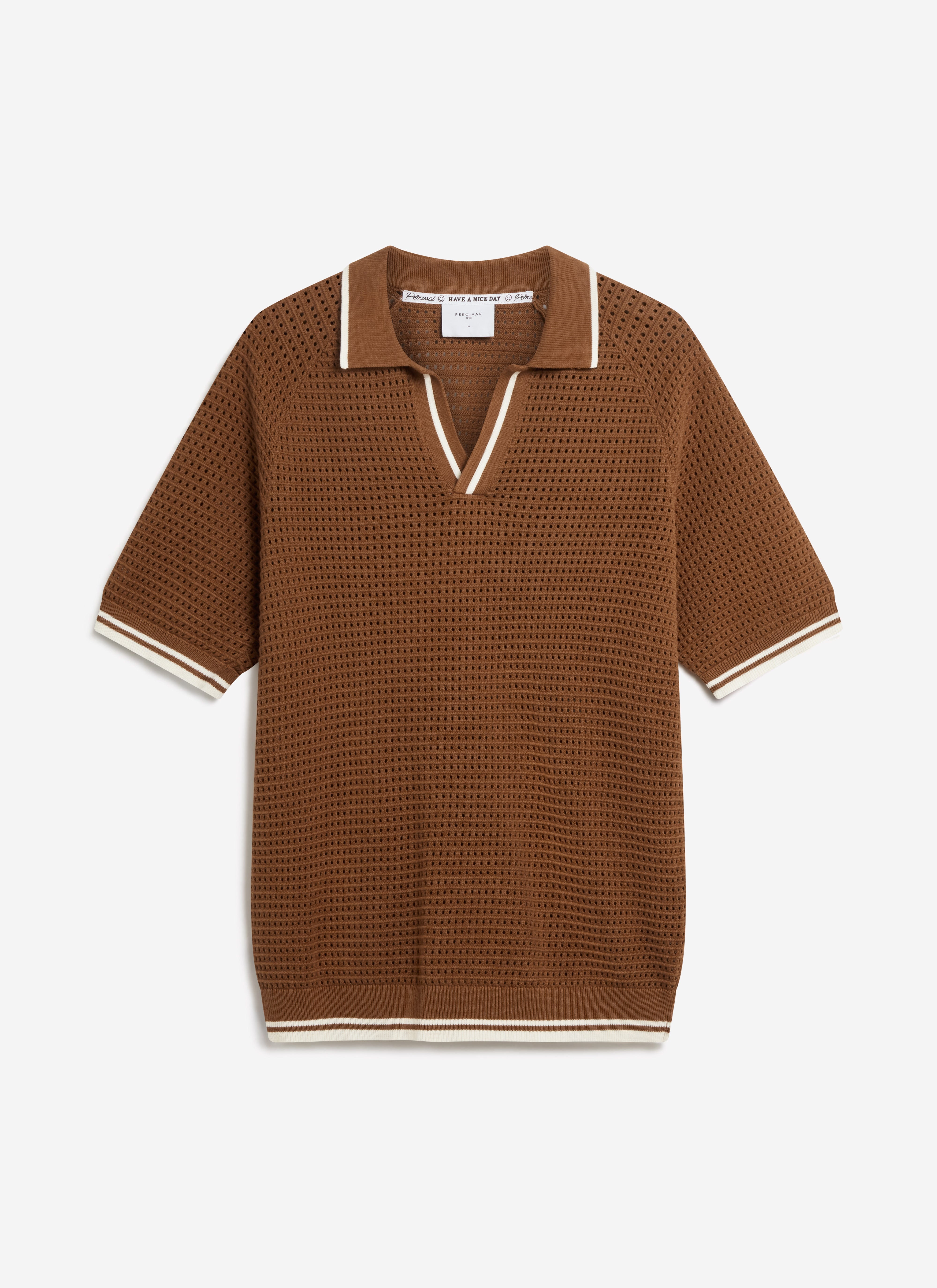 A flat lay of the Percival Tennis Boxy Knitted Polo in brown cotton, showing the perforated knit and white stripe detailing.