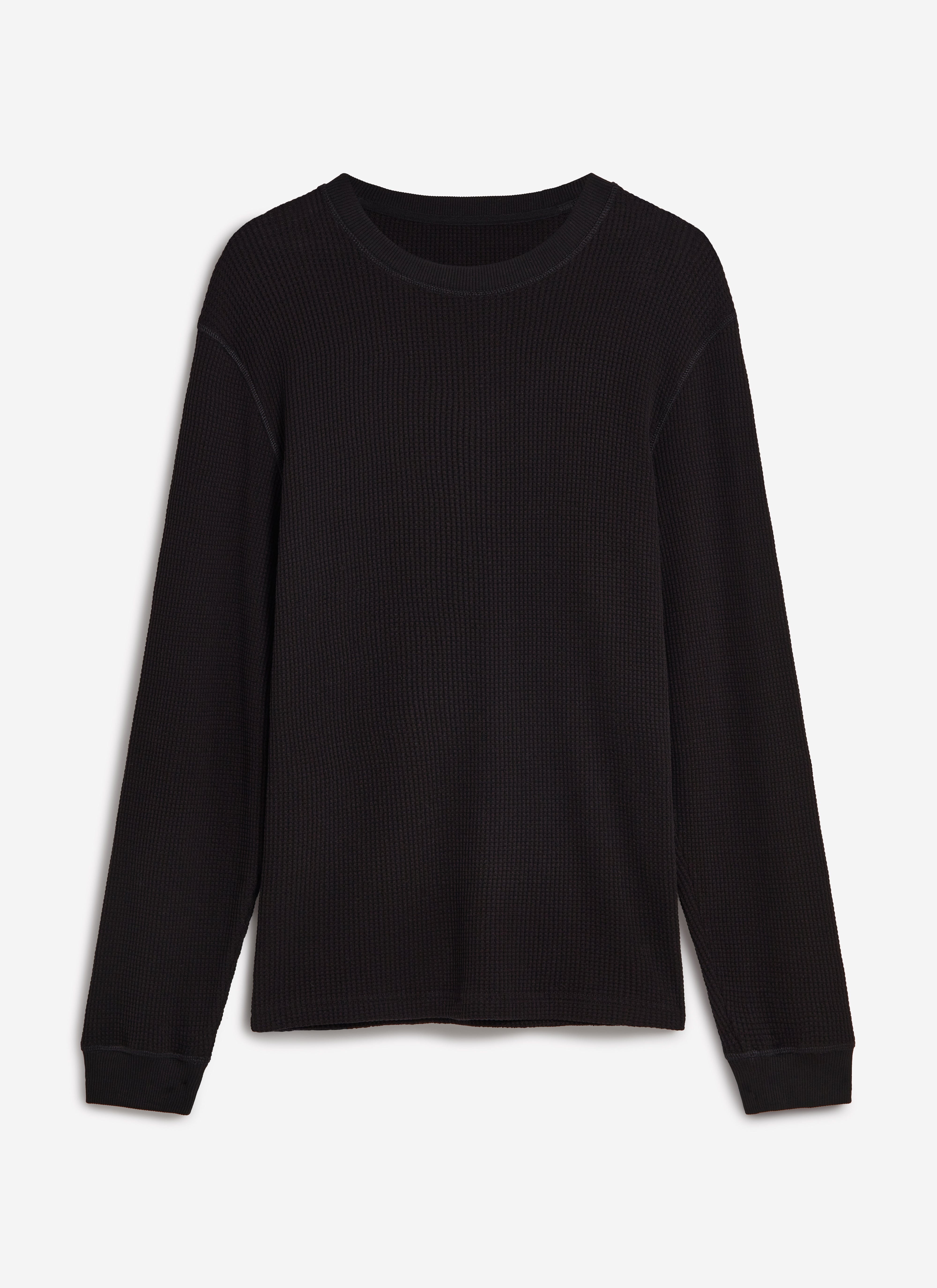 A flat lay of the Percival Waffle Long Sleeve T-Shirt in black, showing the textured organic cotton fabric.