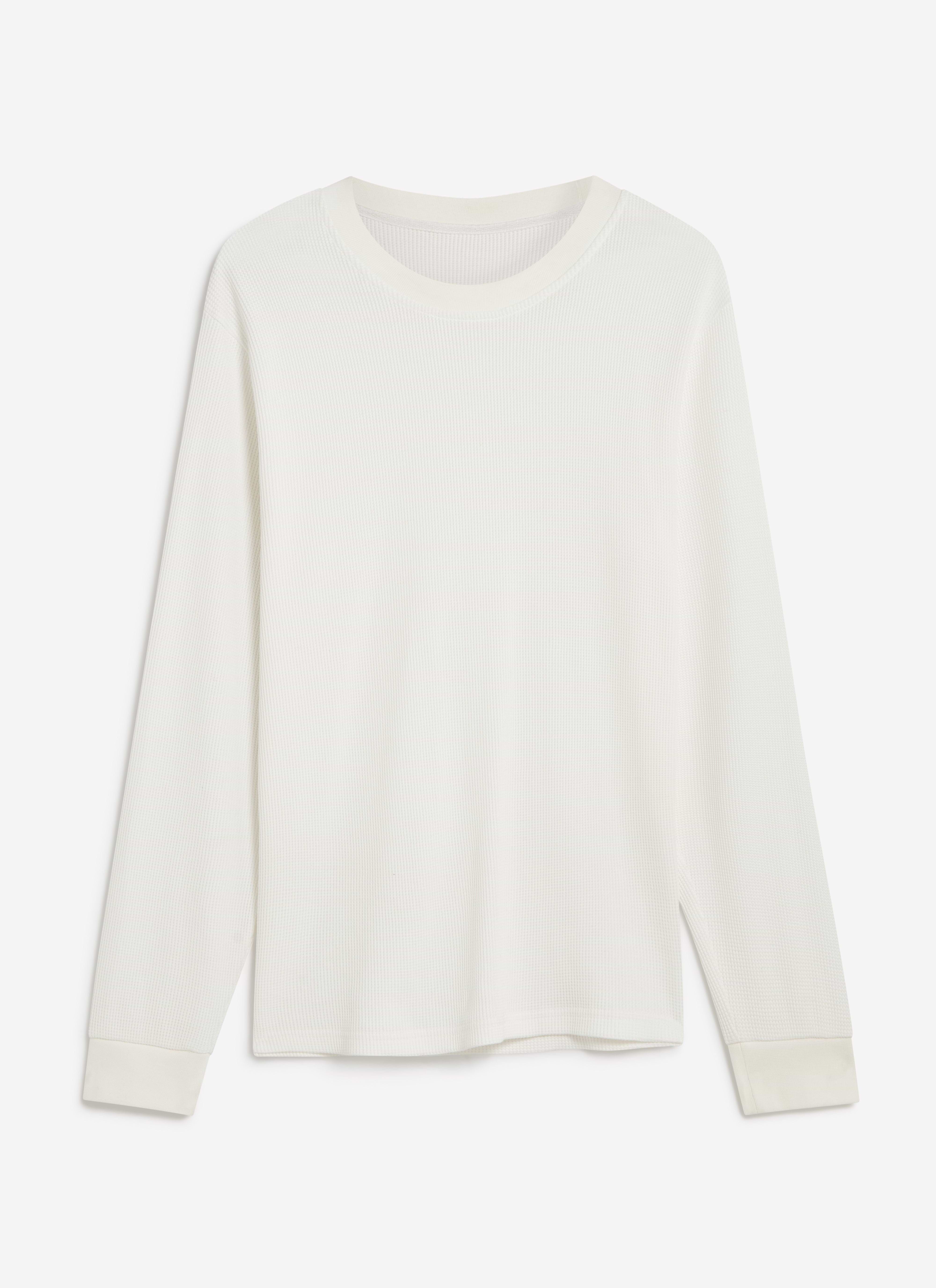 A flat lay of the Percival Waffle Long Sleeve T Shirt in white, showing its textured organic cotton waffle knit.
