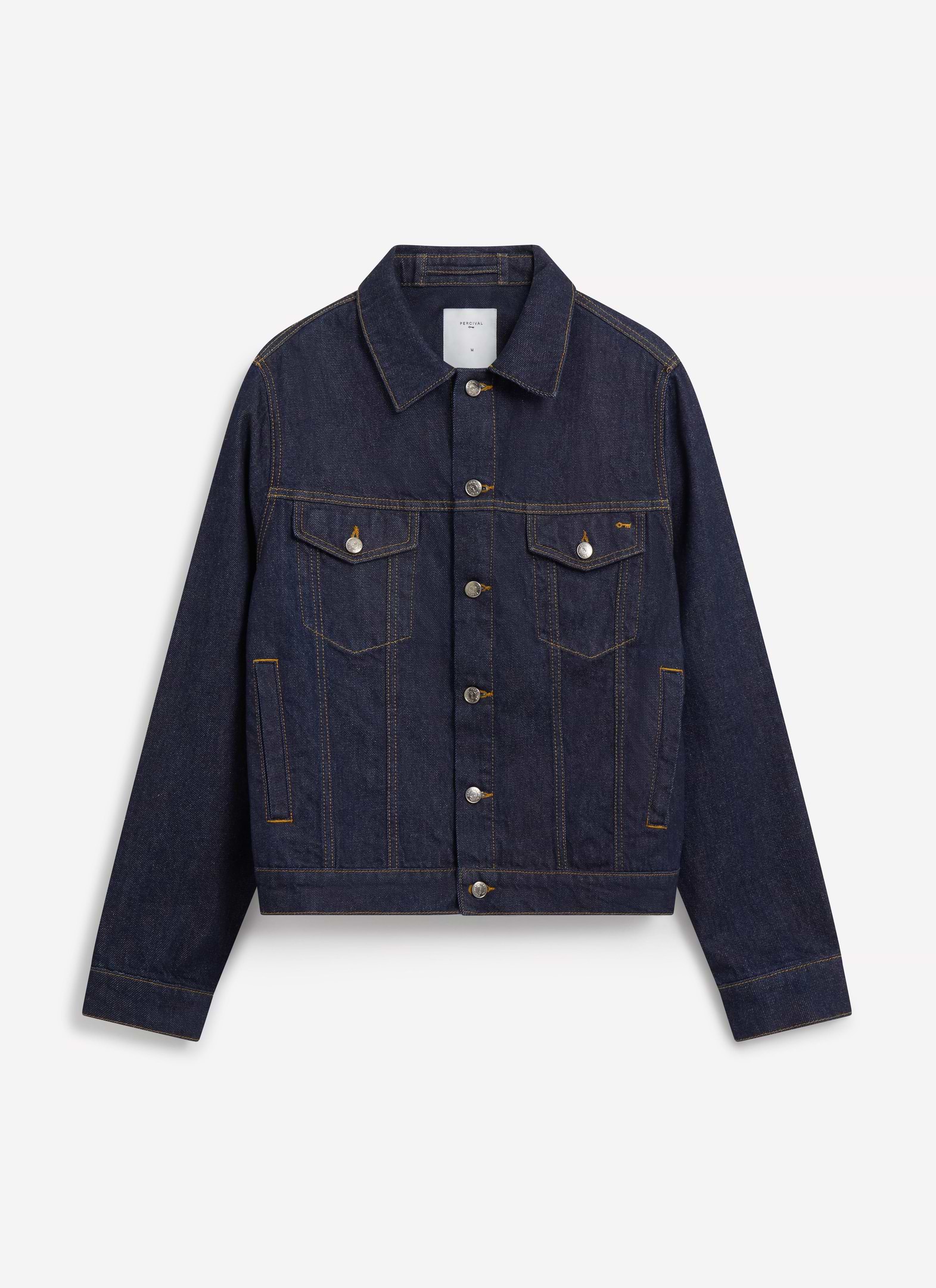 The Percival Western Trucker Jacket in dark indigo denim with contrast stitching, shot flat on a white background.