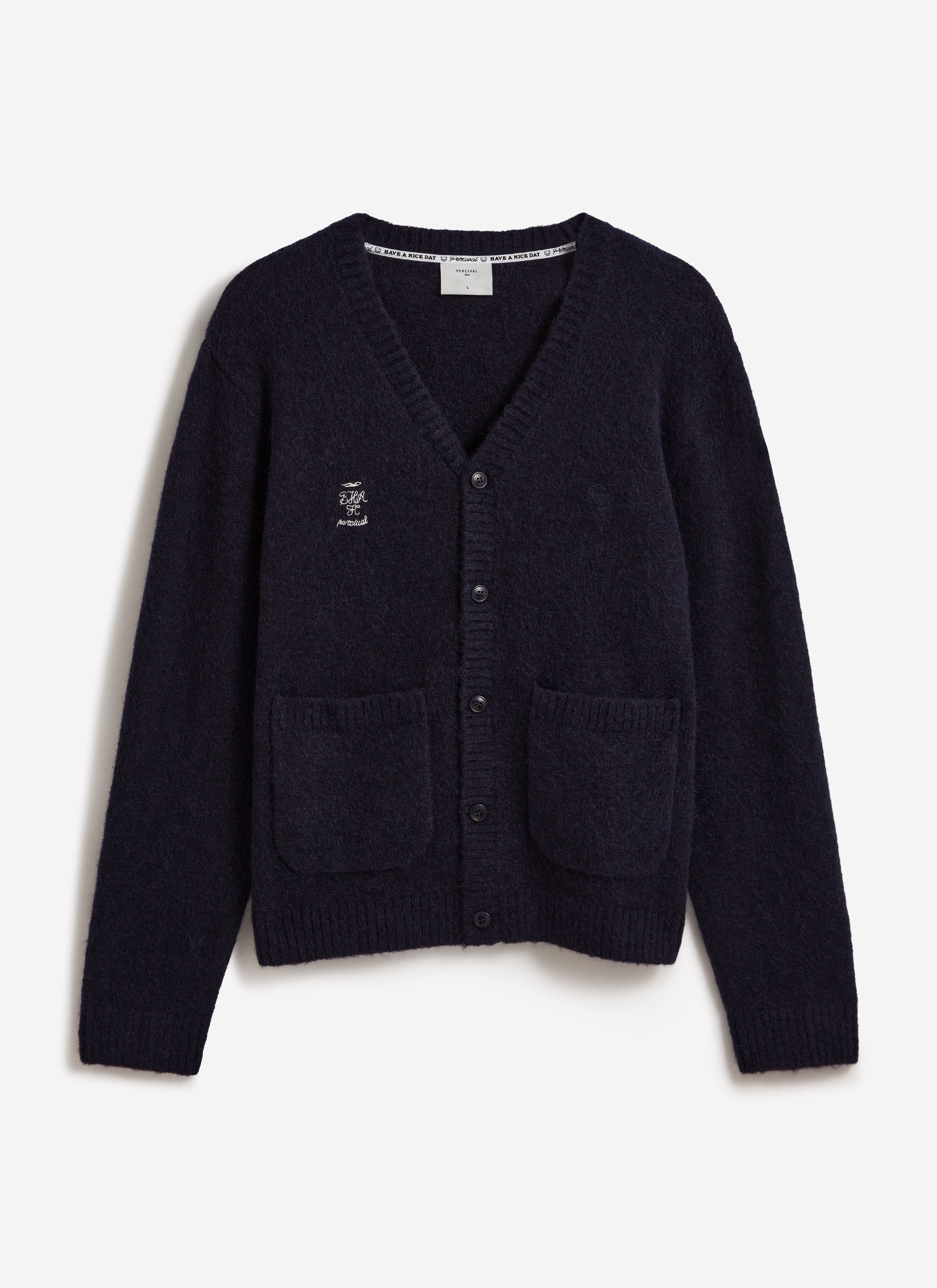 A front view of the navy White Glove Cardigan by Percival x Brighton & Hove Albion F.C. with white chest embroidery.