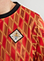 red football shirt with diamond shapes and octopus logo on left chest
