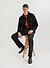 red football shirt with diamond shapes styled with black jacket, jeans and burgundy loafers