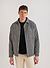 grey casentino overshirt styled with black boucle wool crew neck and beige trousers