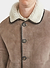 close up of light brown suede and white shearling coat with collar and buttons