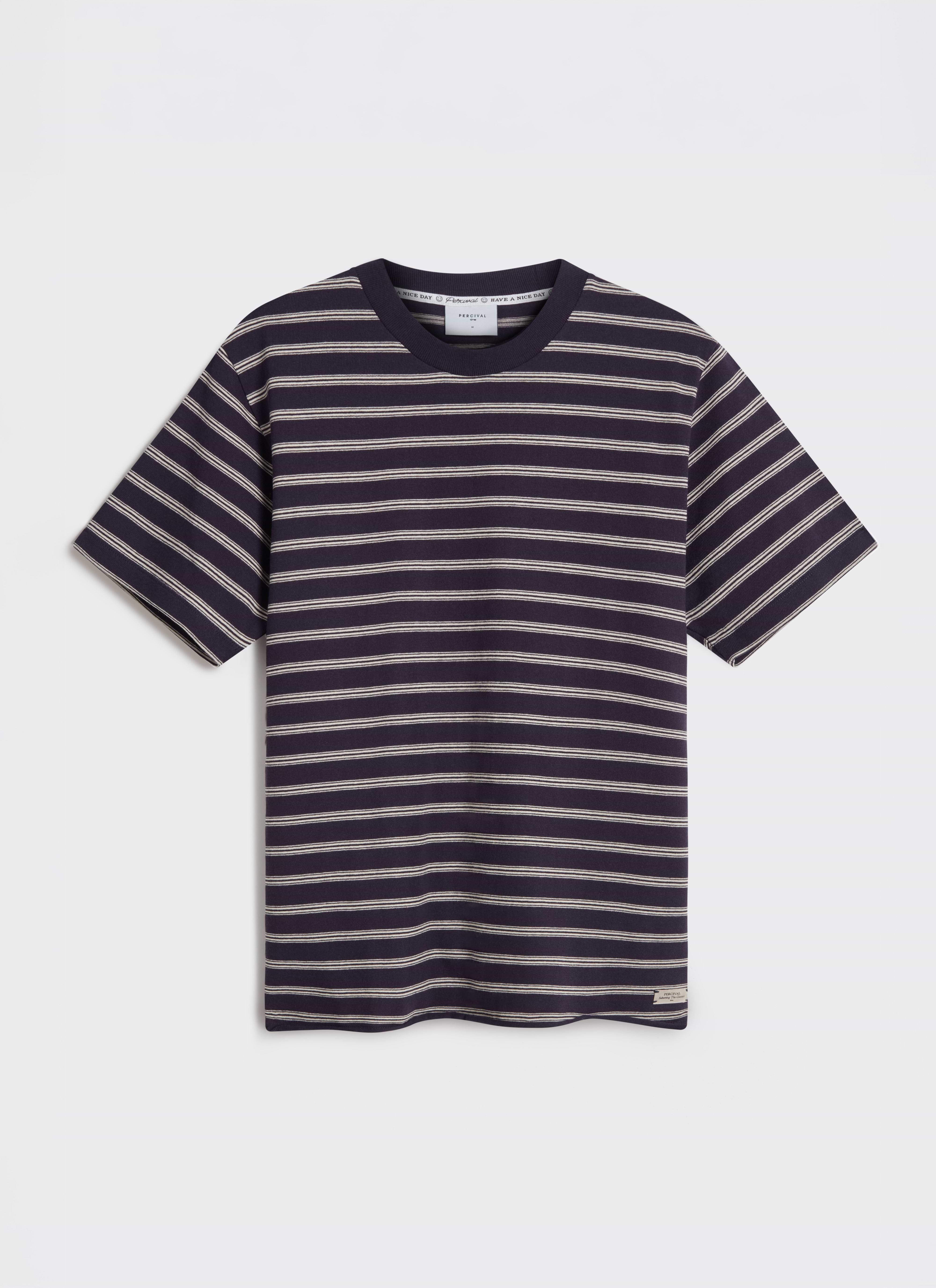 A flat lay of the Percival Arlo Raw Hem Breton T-shirt in navy organic cotton, showing the fine white horizontal stripes.
