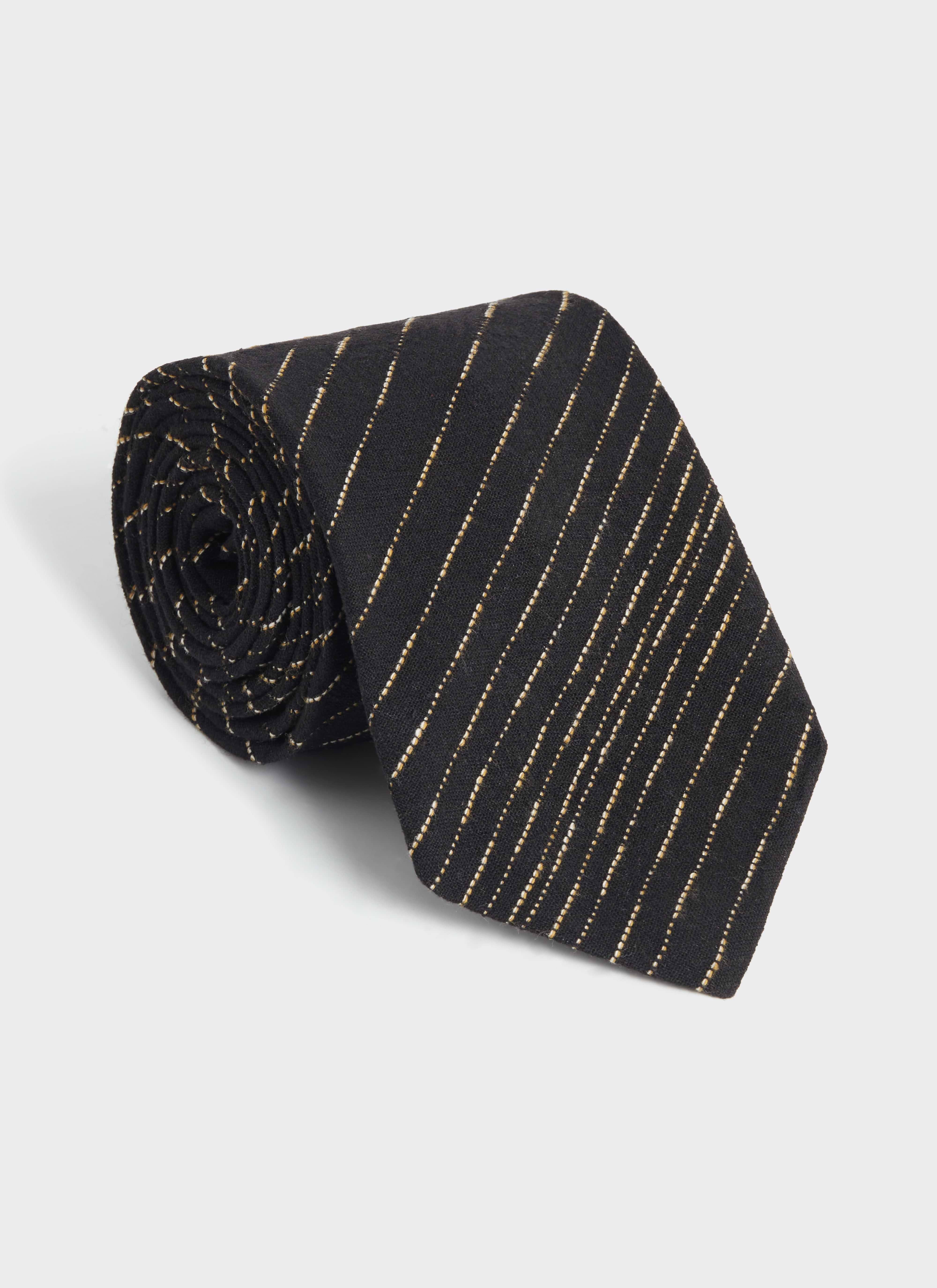 Rolled up view of the black cotton Percival Leland Tie, featuring a thin white dashed stripe pattern throughout.