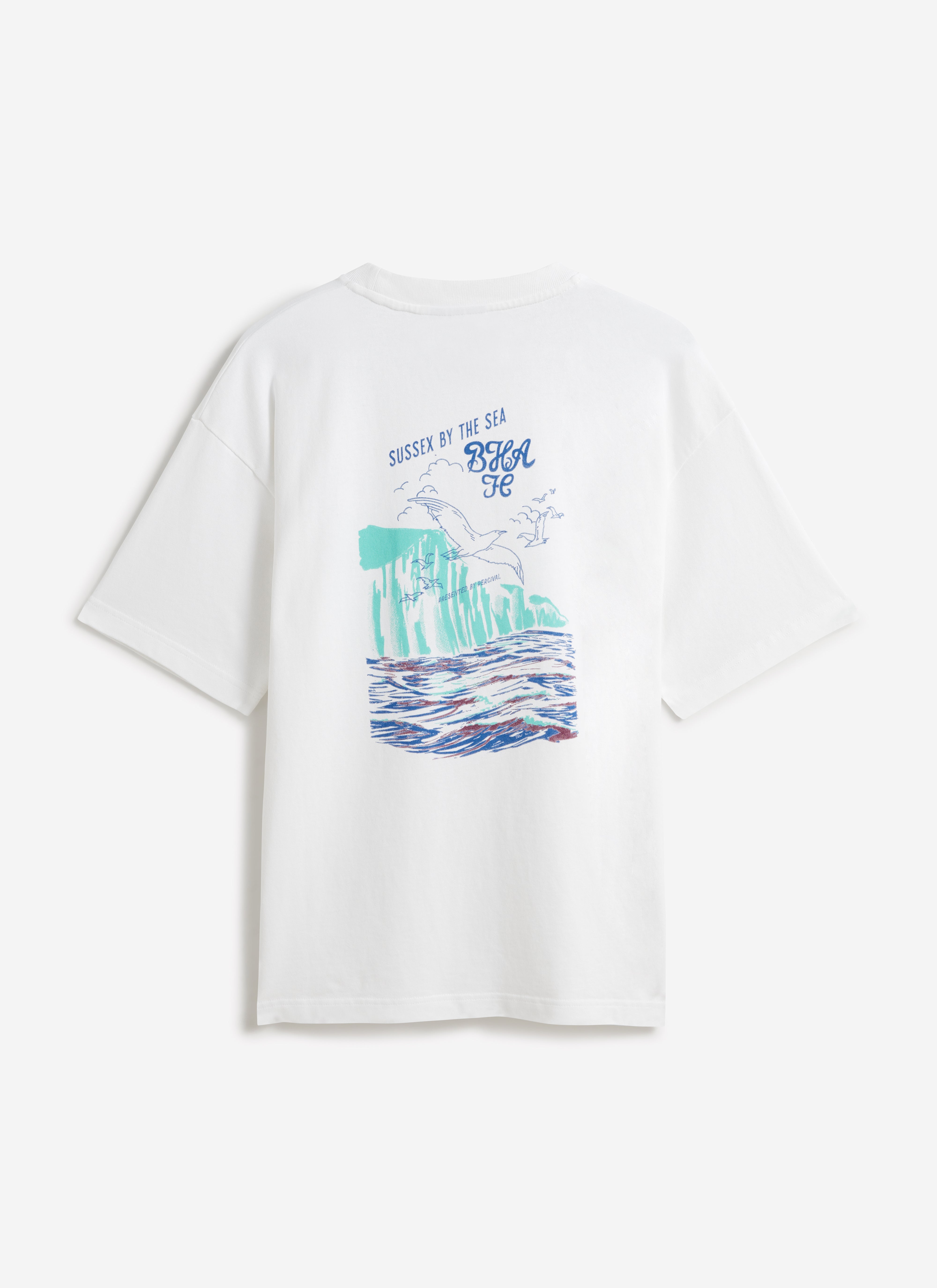 The back of the white Percival x Brighton & Hove Albion F.C. Beach Front T-shirt featuring a hand-drawn seaside graphic.
