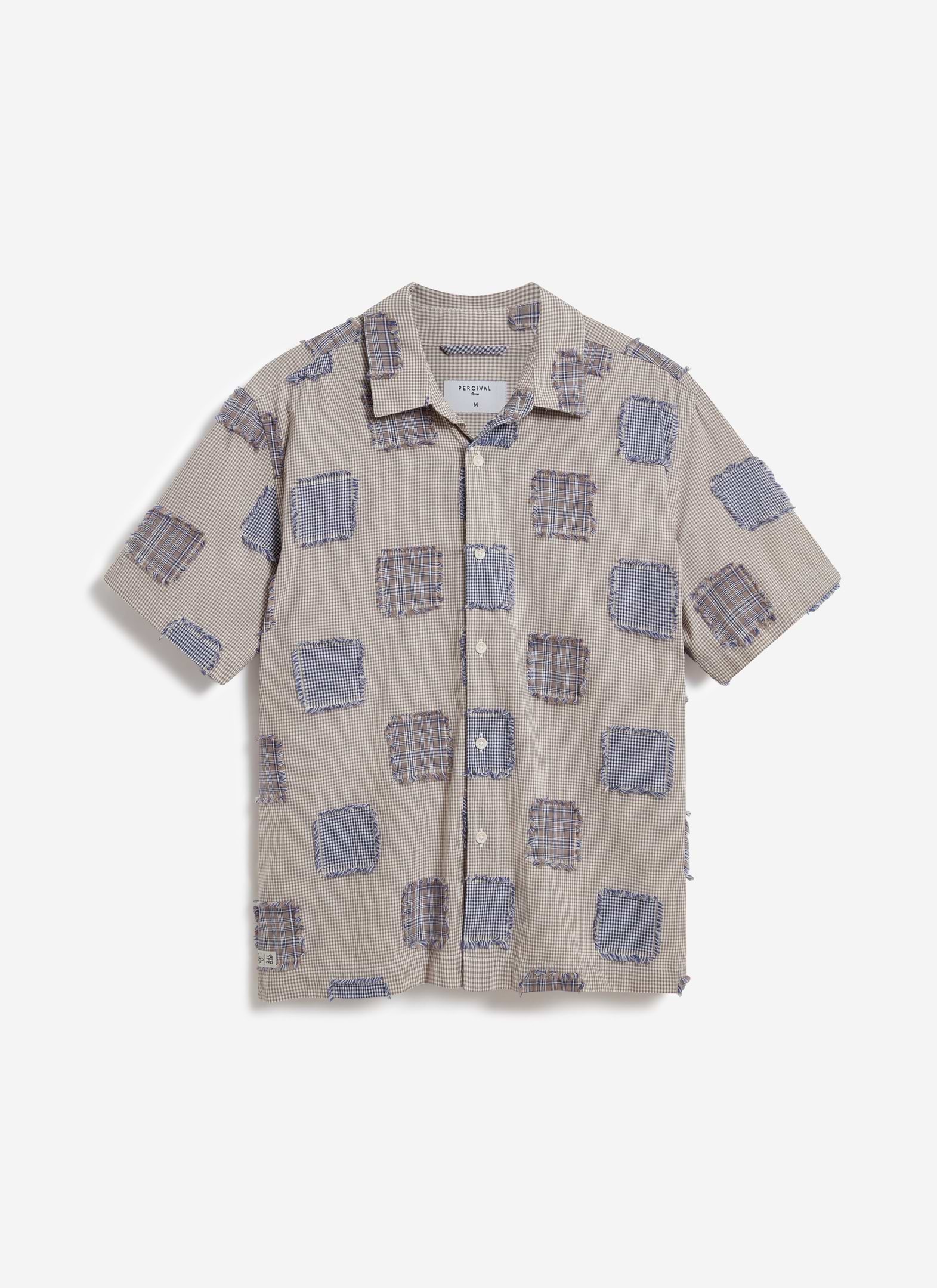 Front view of the Percival Bruno Boxy Clerk Shirt in grey, a patchwork design with frayed flannel panels on a checked base.