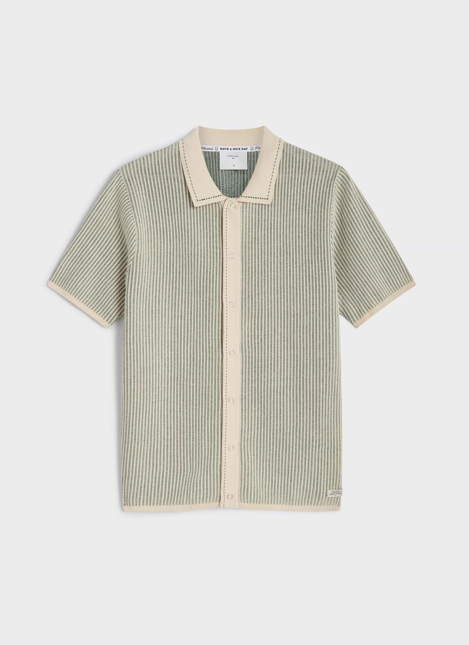 Flat lay of the Percival Dixon Knitted Polo in cream and sage, featuring a vertical stitch and press-stud button front.
