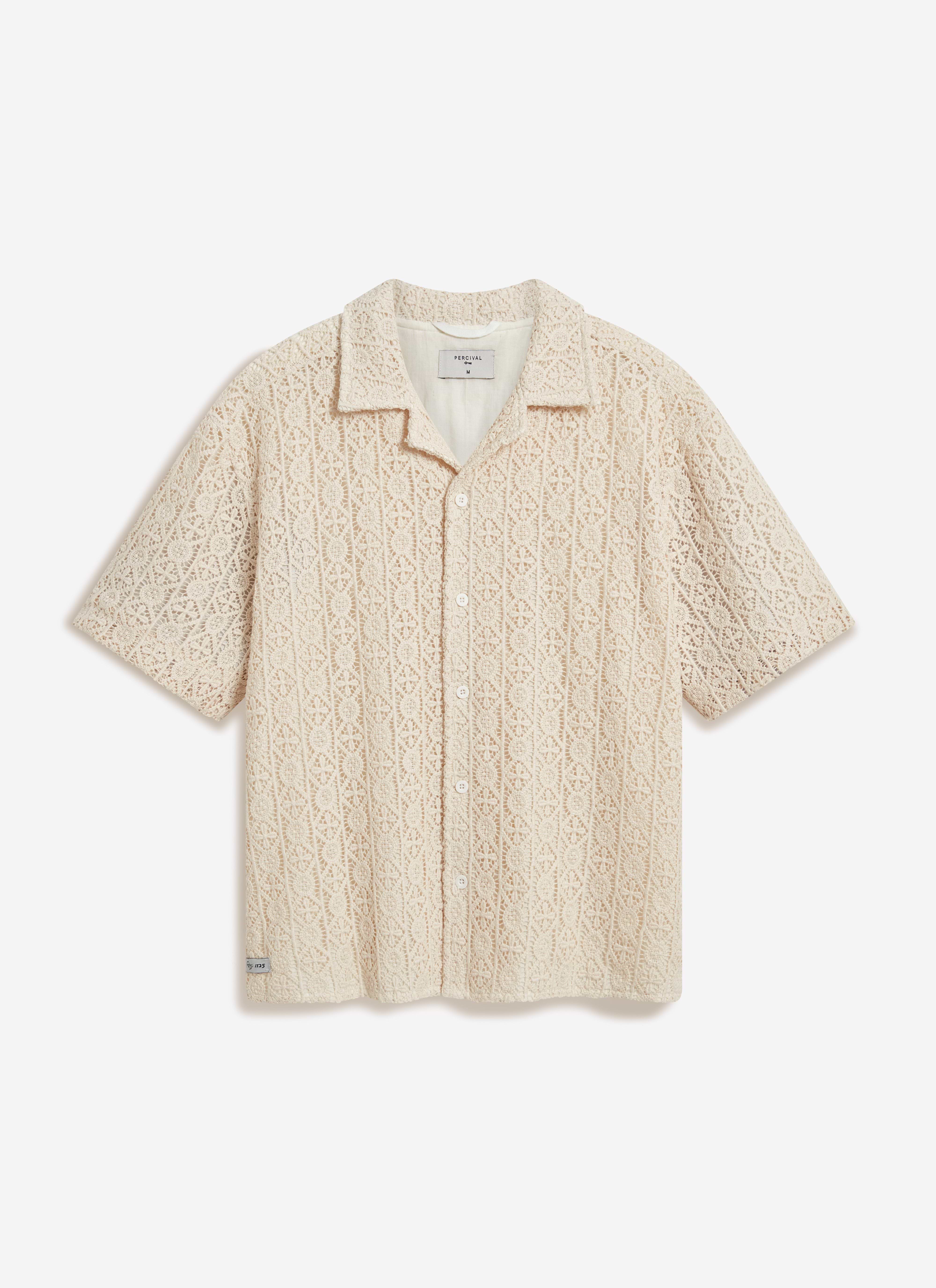 The Percival Elio Crochet Cuban Shirt in ecru, a short-sleeved button-down with an intricate all-over crochet pattern.