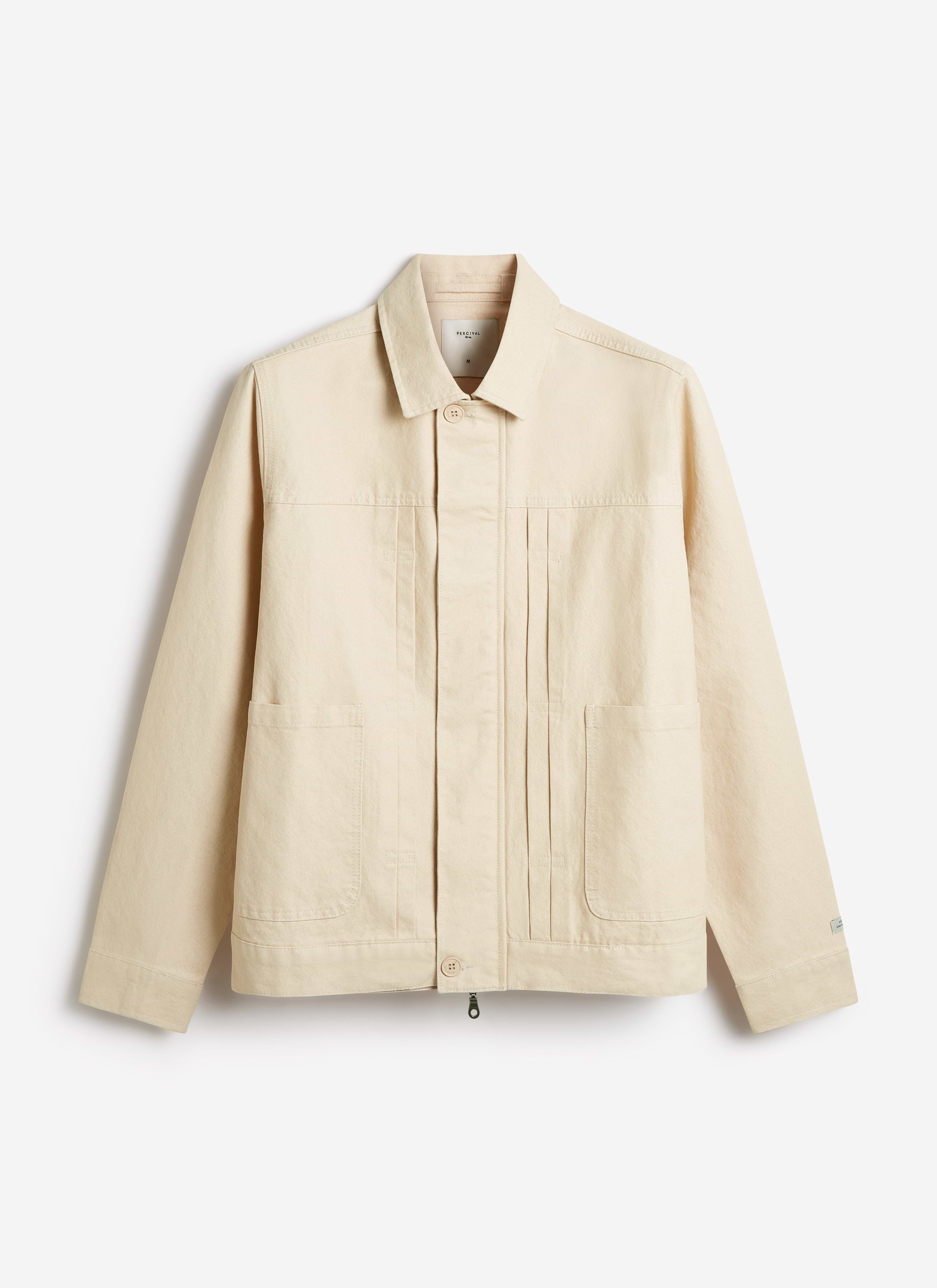 Percival Ernst Jacket in ecru cotton, featuring a structured field jacket silhouette with twin pleats and patch pockets.