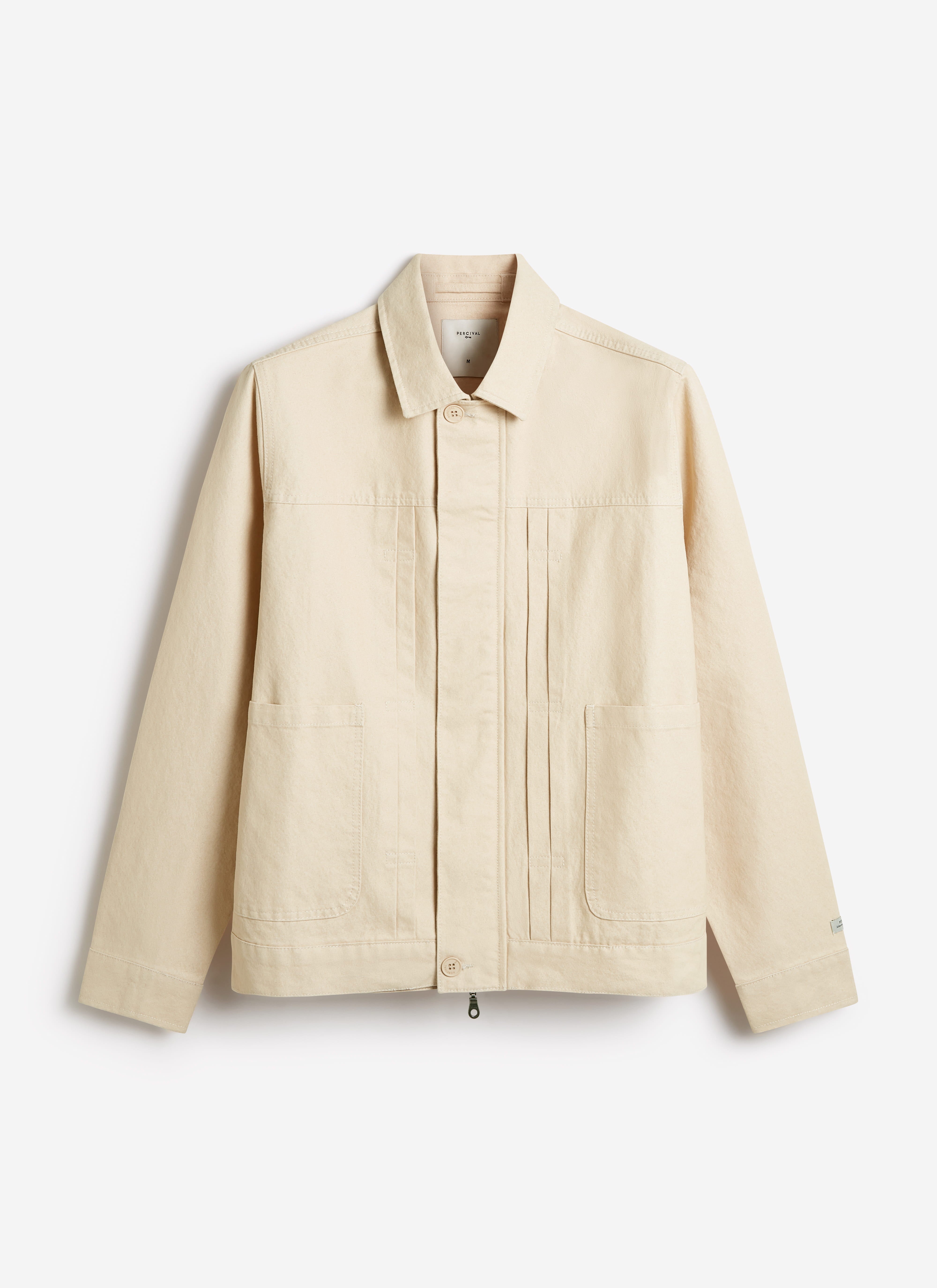Percival Ernst Jacket in ecru cotton, featuring a structured field jacket silhouette with twin pleats and patch pockets.