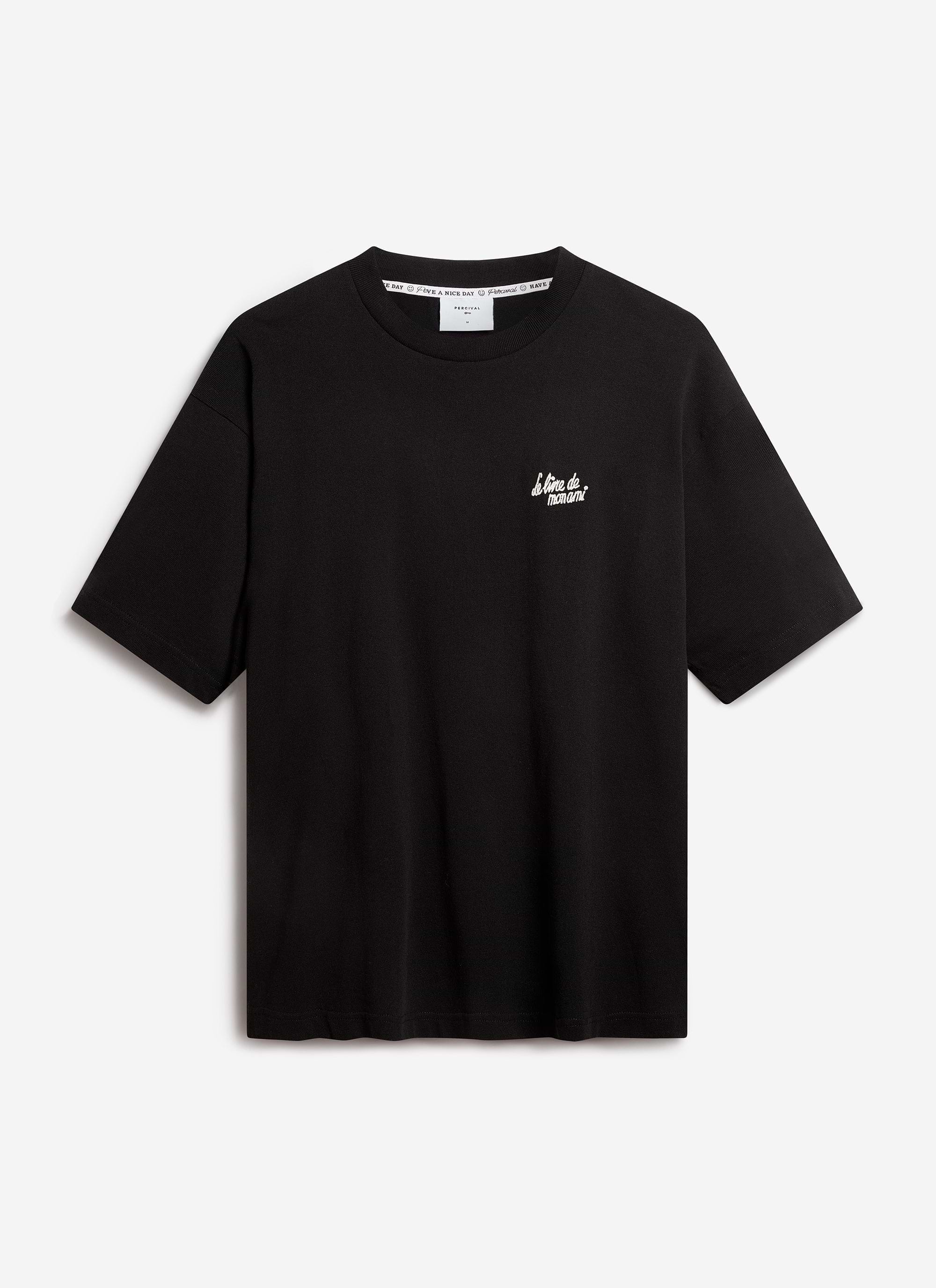 The Percival Le Livre De Mon Ami oversized t-shirt in black, laid flat to show the white chest embroidery.