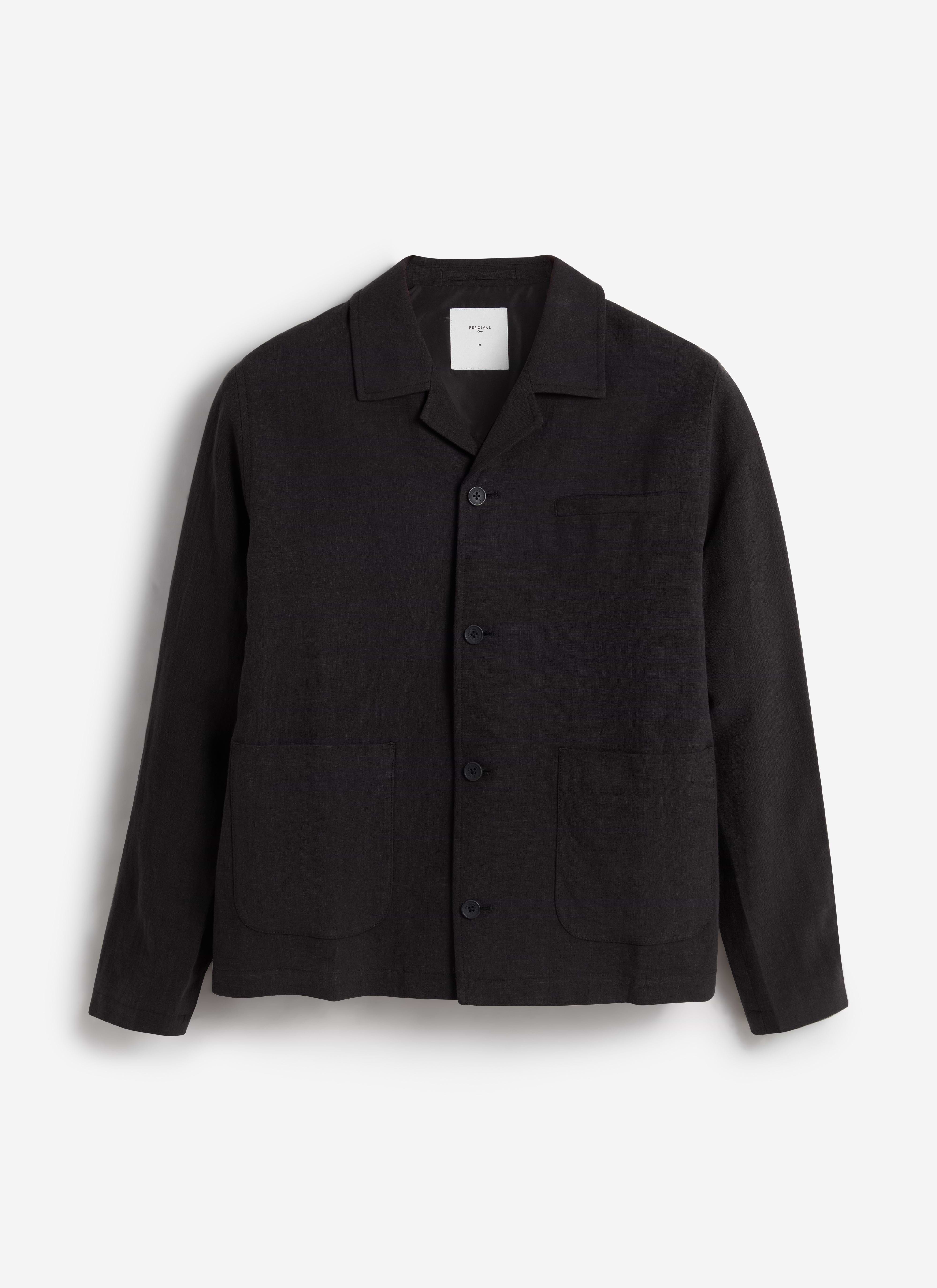 A flat lay of the Percival Linen Overshirt in black, showing its button front, collar and three front pockets.