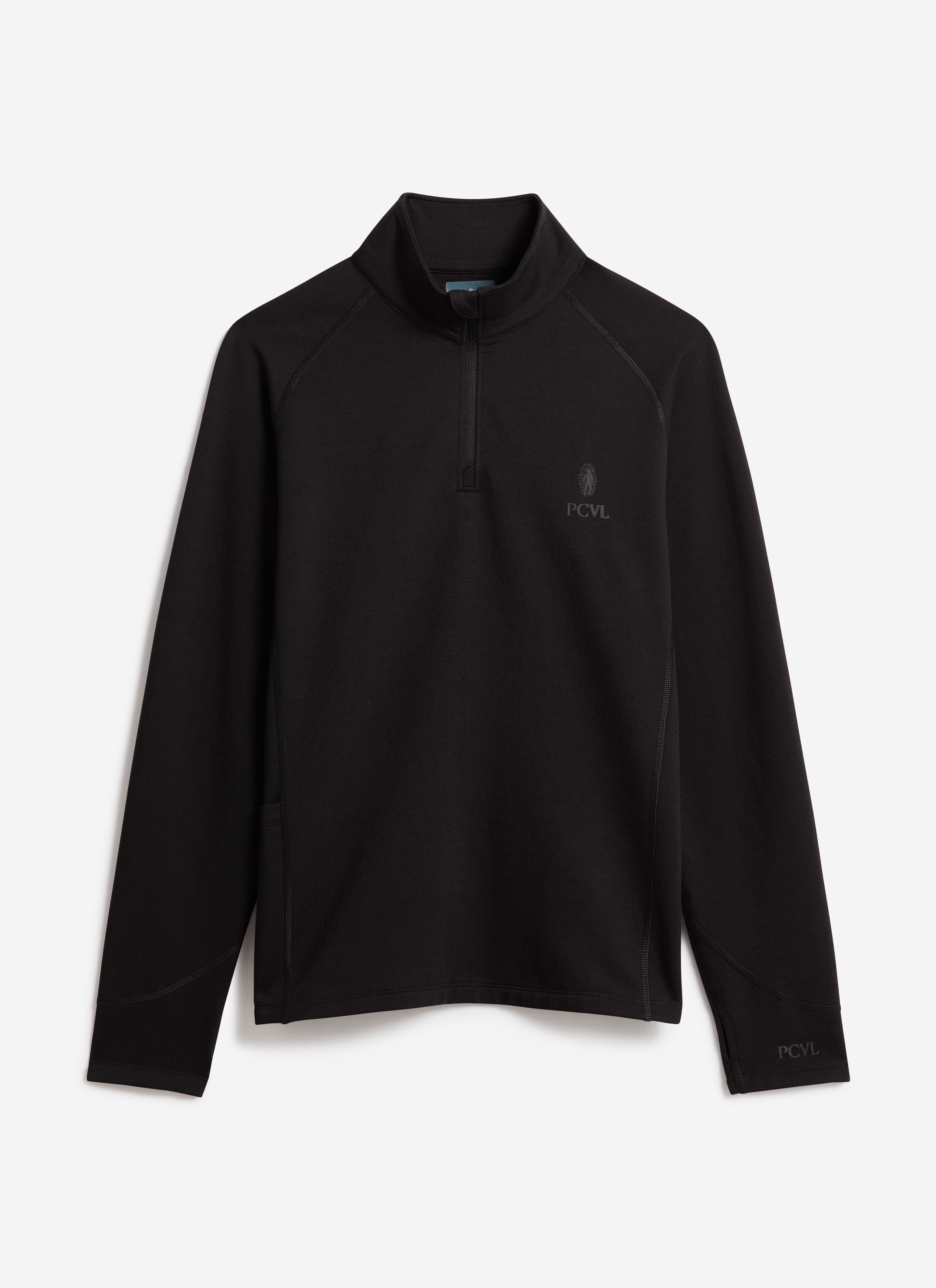 A flat lay of the PCVL Base Layer Quarter Zip Jacket in black by Percival, showing the funnel neck and subtle chest branding.