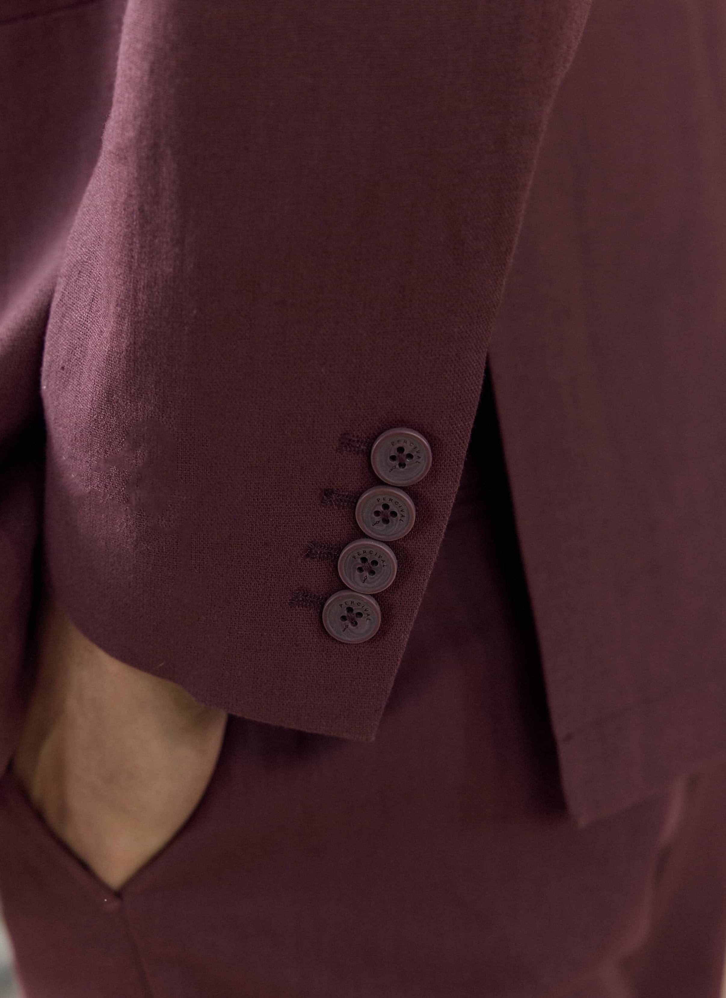 Branded cuff buttons on the merlot Percival Tailored Linen Blazer, highlighting the linen-cotton fabric texture.