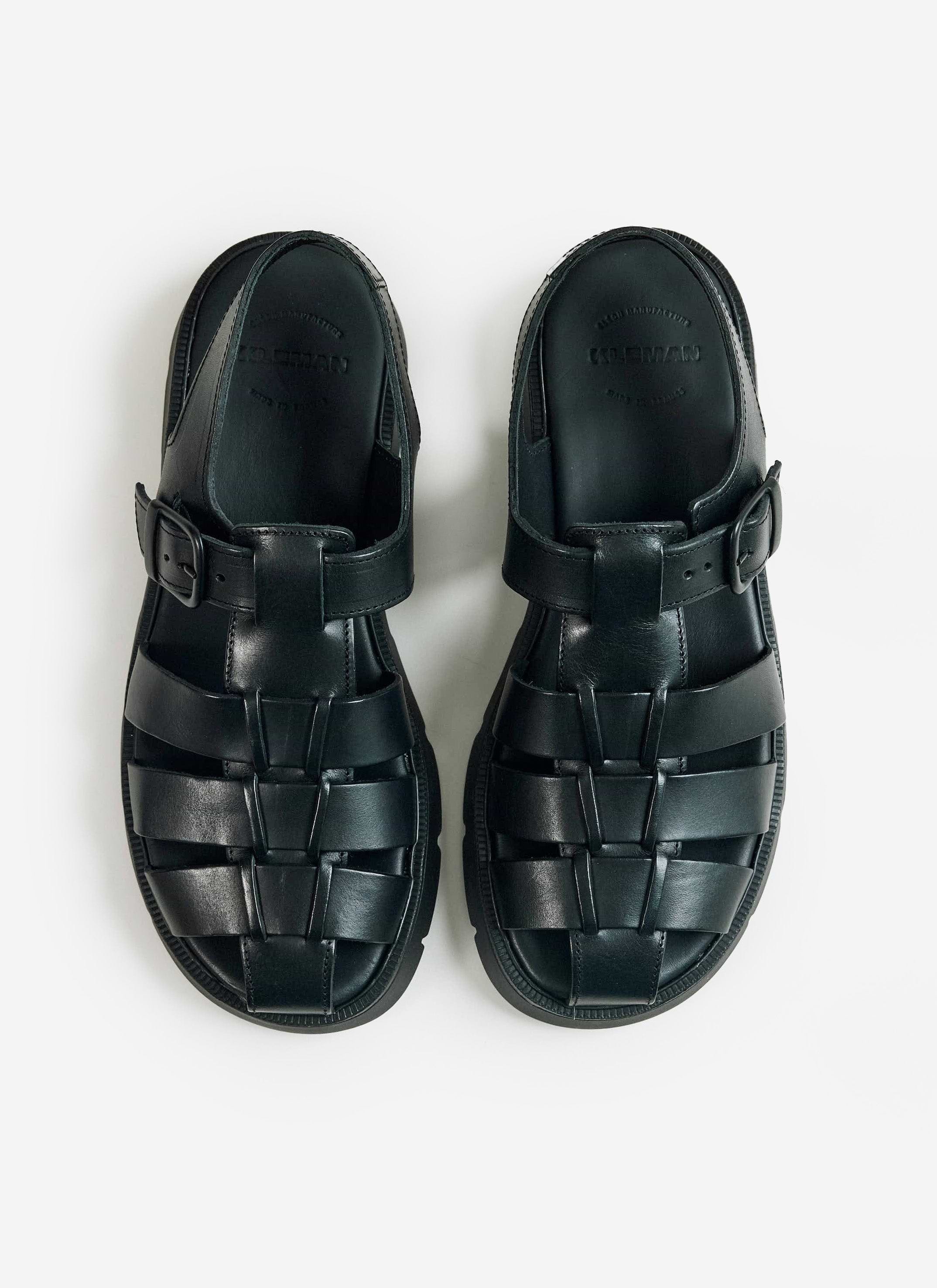 A pair of black Kleman Babord VGT fisherman sandals from Percival, featuring a leather weave and buckle closure.