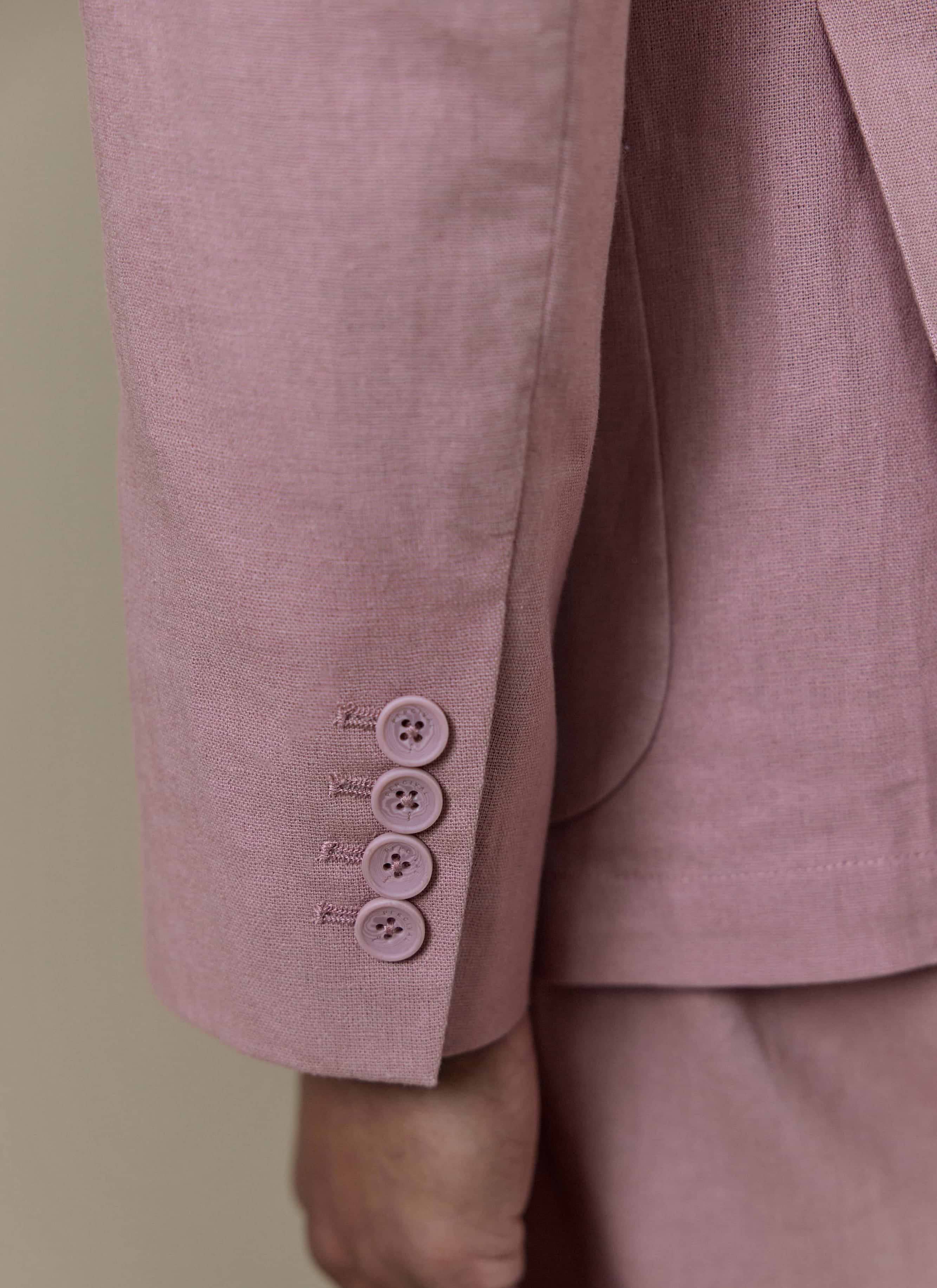 Close-up of the four-button working cuff on the dusty pink Percival Tailored Linen Blazer in a linen-cotton blend.