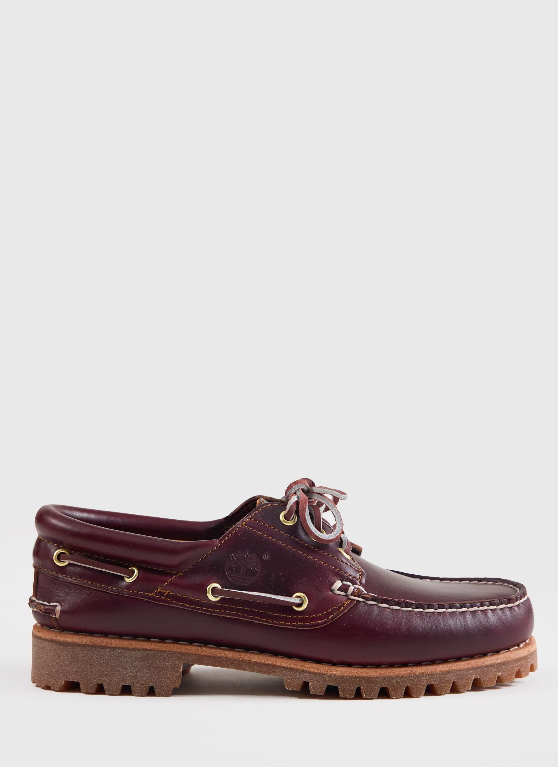 Side profile of the Timberland Authentic Boat Shoe in burgundy leather with a lug sole, from Percival.