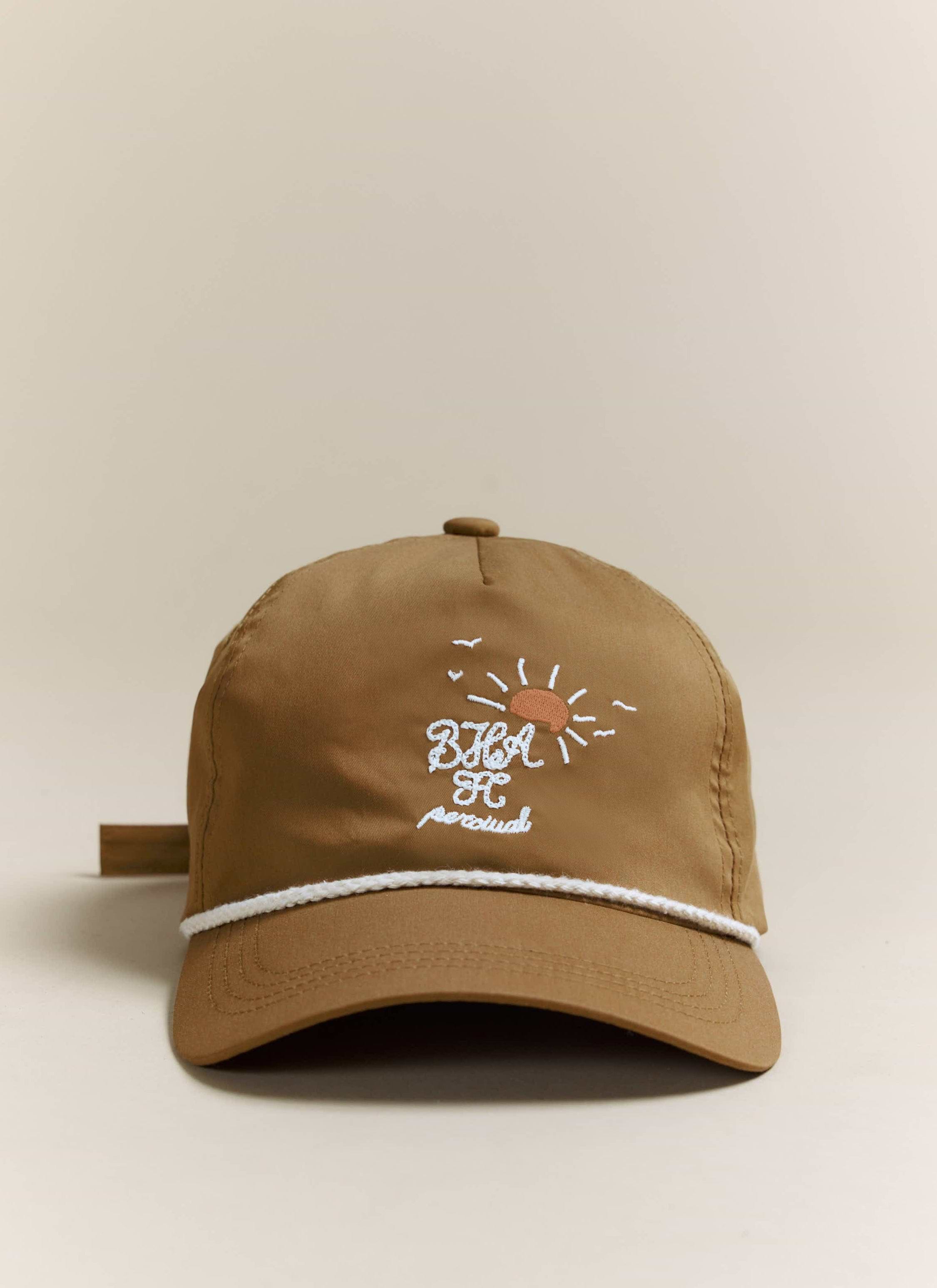 Front view of the Percival x Brighton & Hove Albion F.C. Trucker Cap in rust, showing the detailed front embroidery.