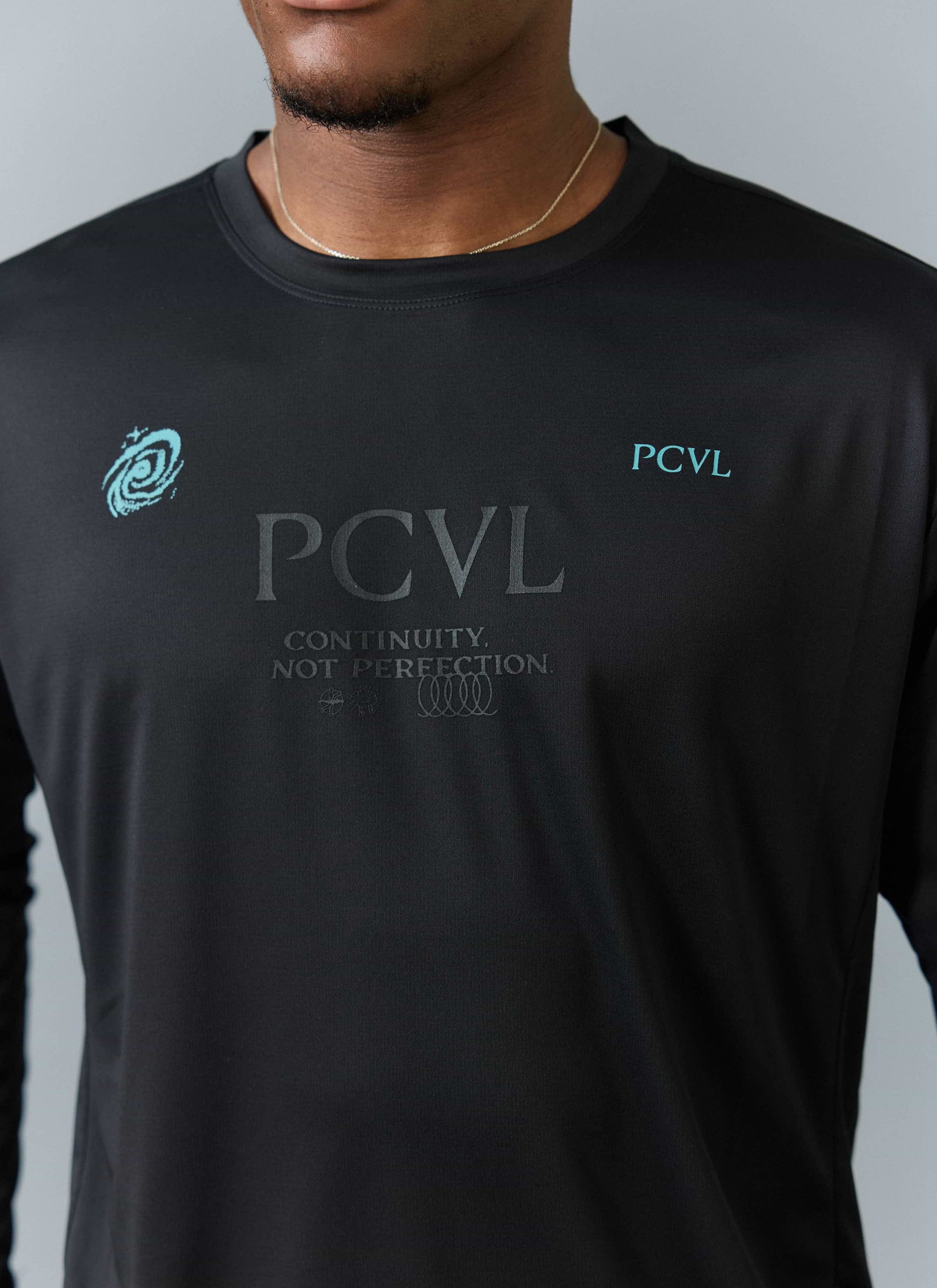Close up of the Percival PCVL Long Sleeve Printed Performance Top in black, showing the tonal and turquoise chest graphics.