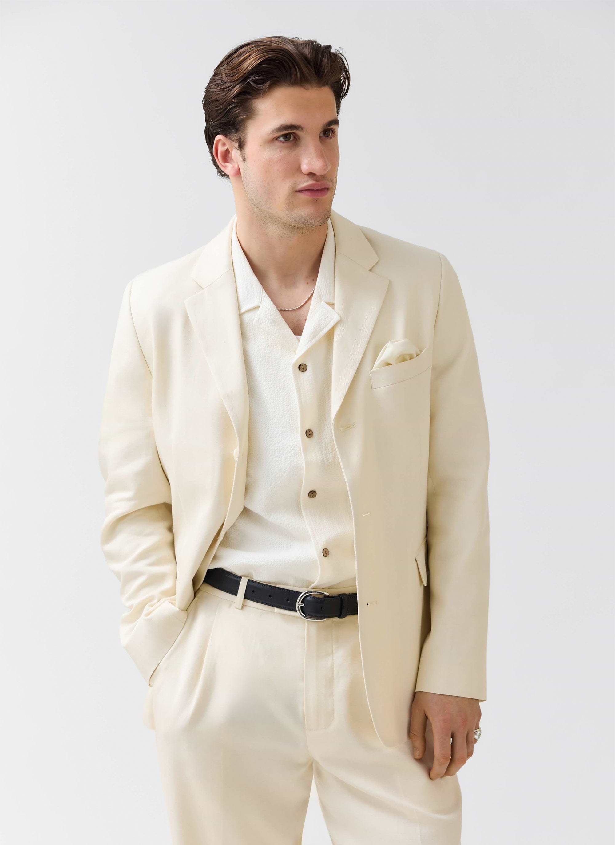 A model wears the Percival Clifton 3 Button Blazer in cream lyocell, styled as a three-piece suit against a white background.