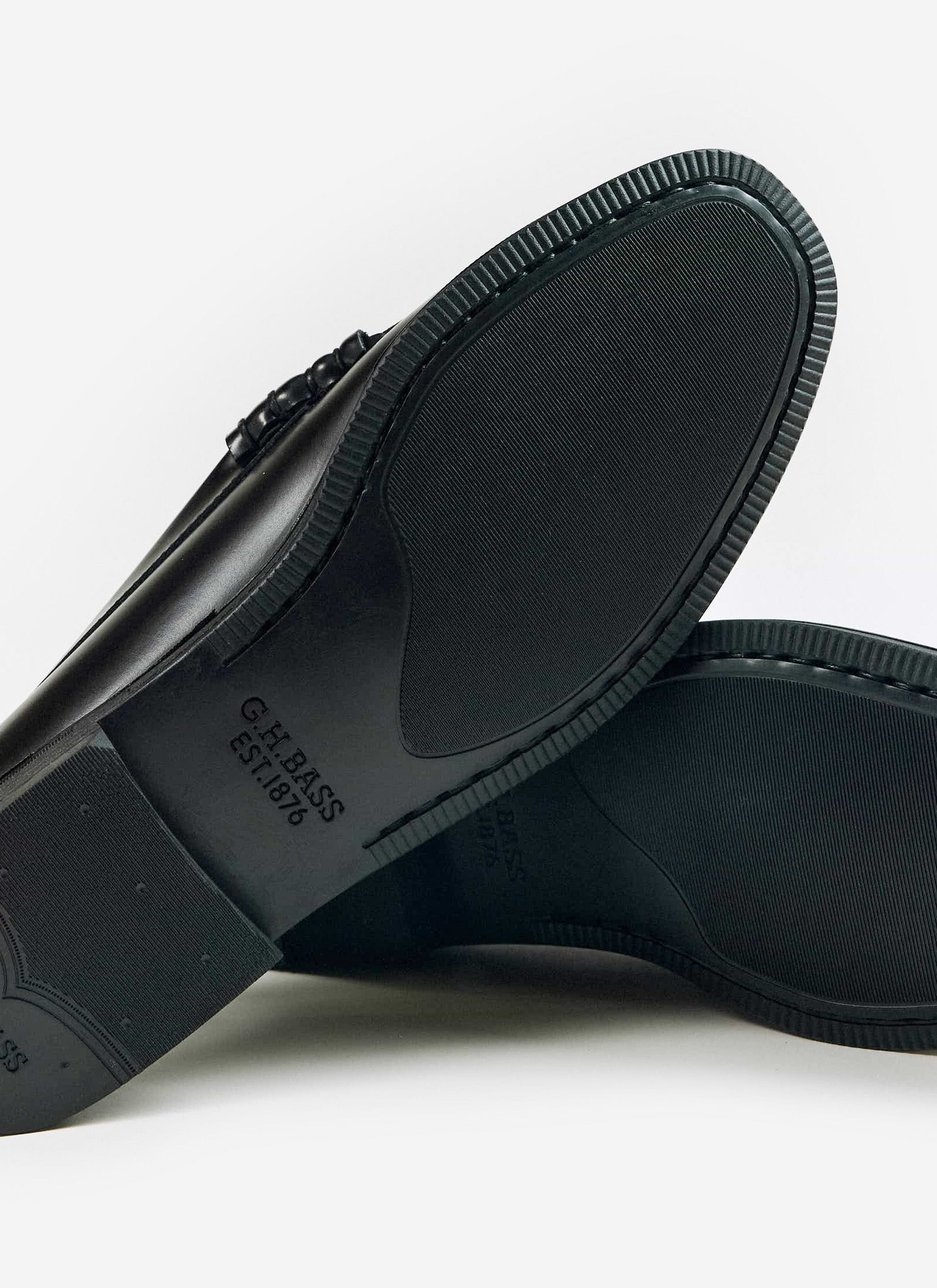 A close-up of the rubber sole on the black G.H. Bass Weejun II Larson Moc Penny loafers, available at Percival.
