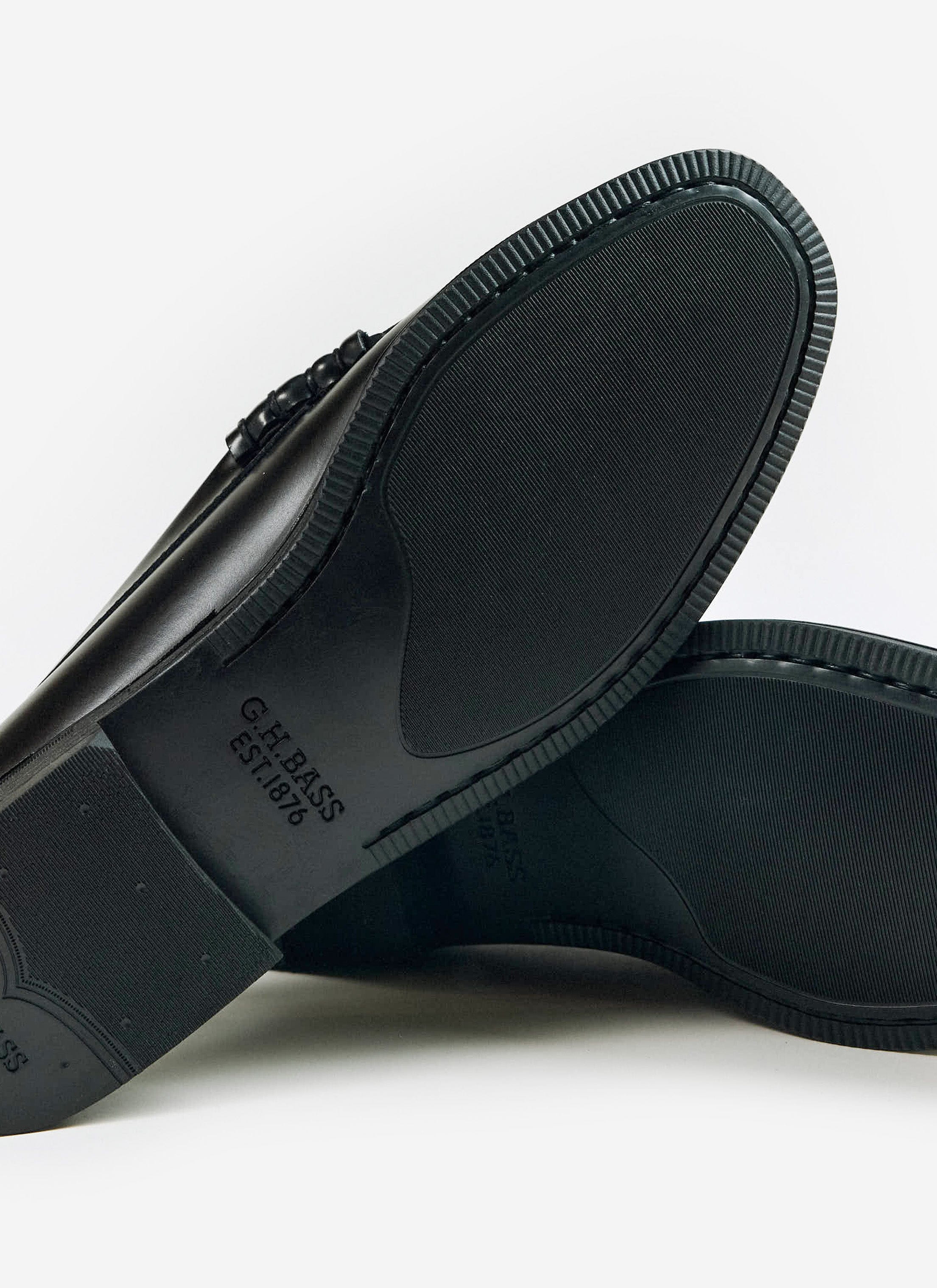 A close-up of the rubber sole on the black G.H. Bass Weejun II Larson Moc Penny loafers, available at Percival.